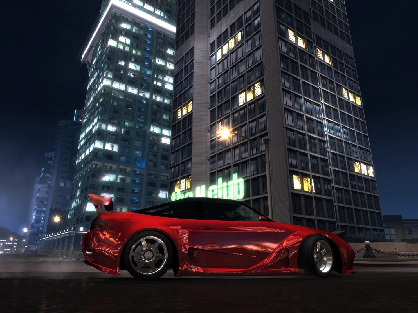 Heatwarped: Red customized sports car parked curbside at night beneath towering lit city skyscrapers.