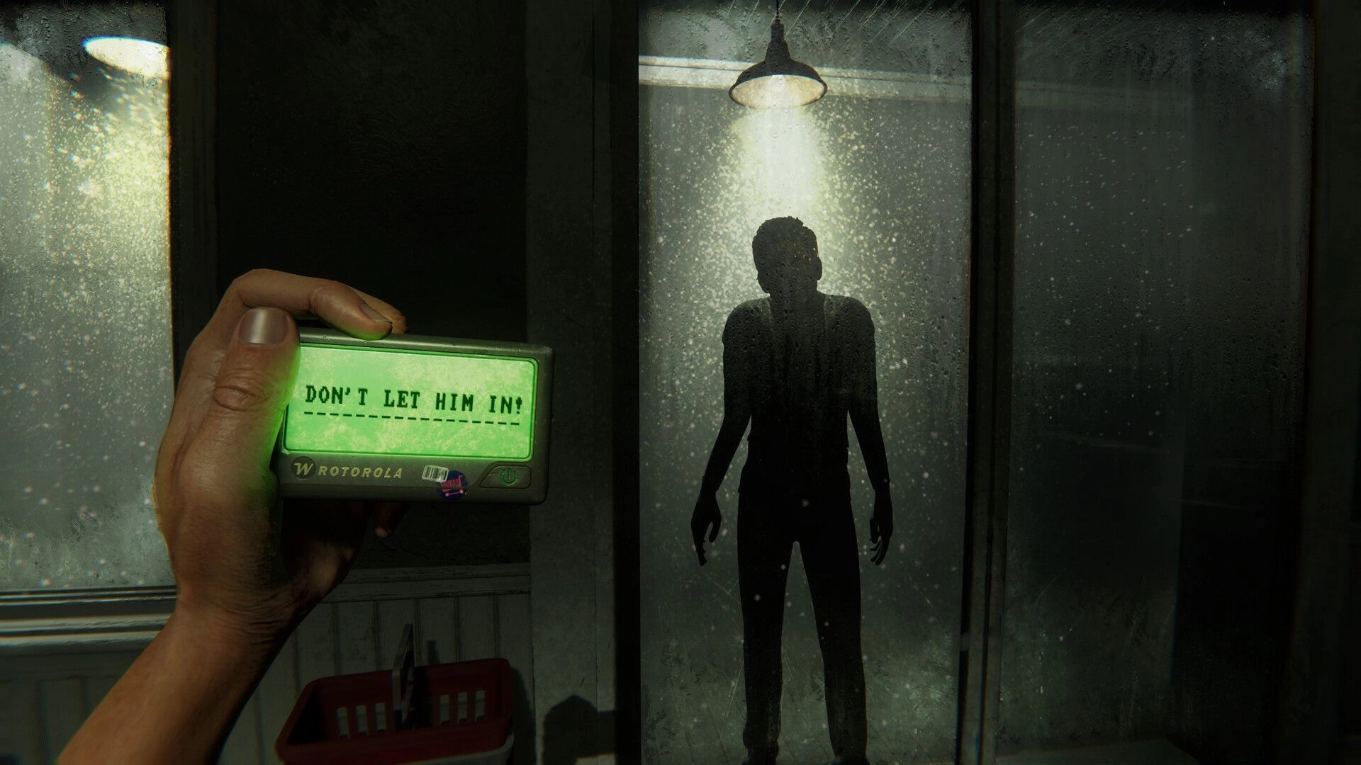 HELLMART: Handheld device reads "DON'T LET HIM IN!" with shadowy figure outside foggy glass door
