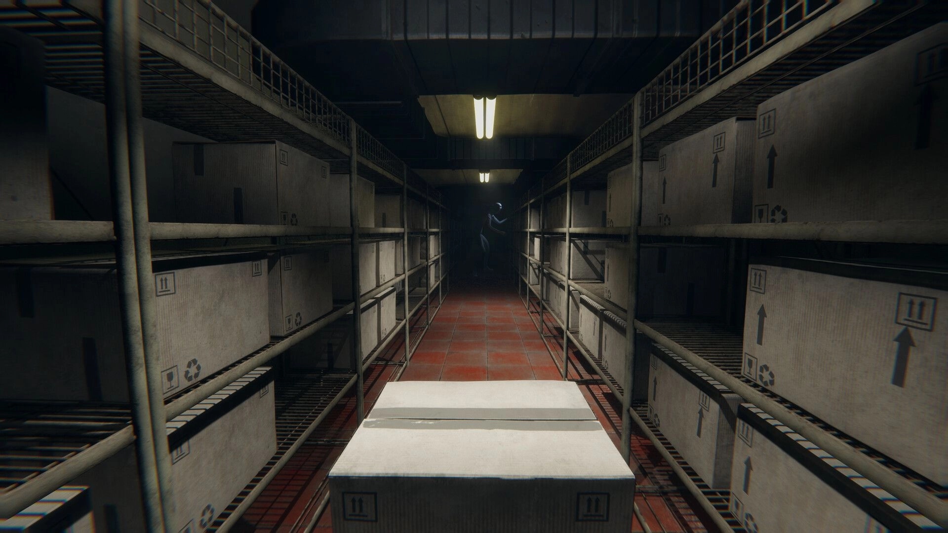 HELLMART: Dimly lit storage room with stacked boxes and a shadowy figure lurking in the distance
