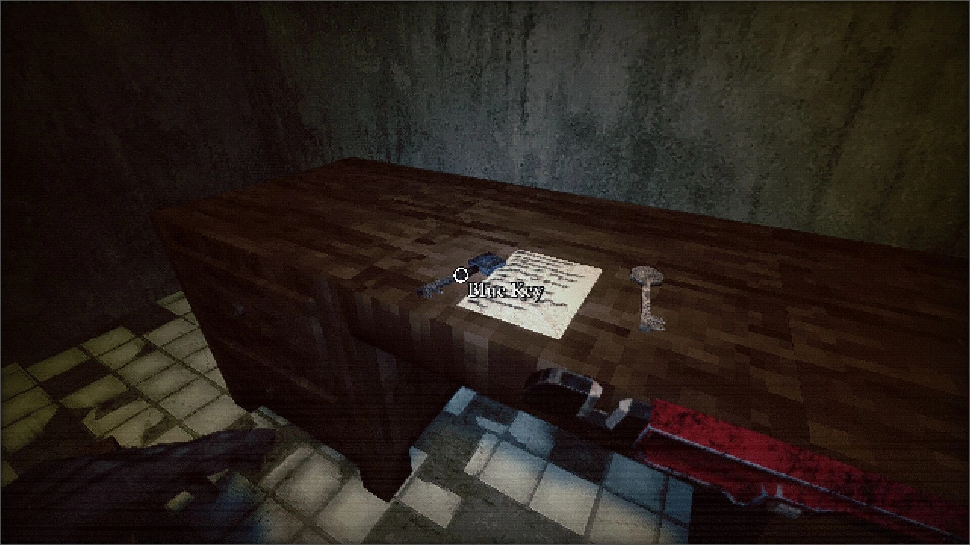 Hemobloom: Player inspects a rusty key on a wooden table in a dimly lit, tiled room