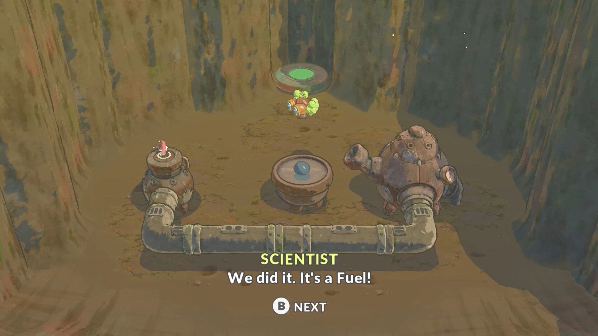 Hoa 2: Dialogue box as scientist celebrates fuel discovery beside pipes and tanks in a rocky pit.