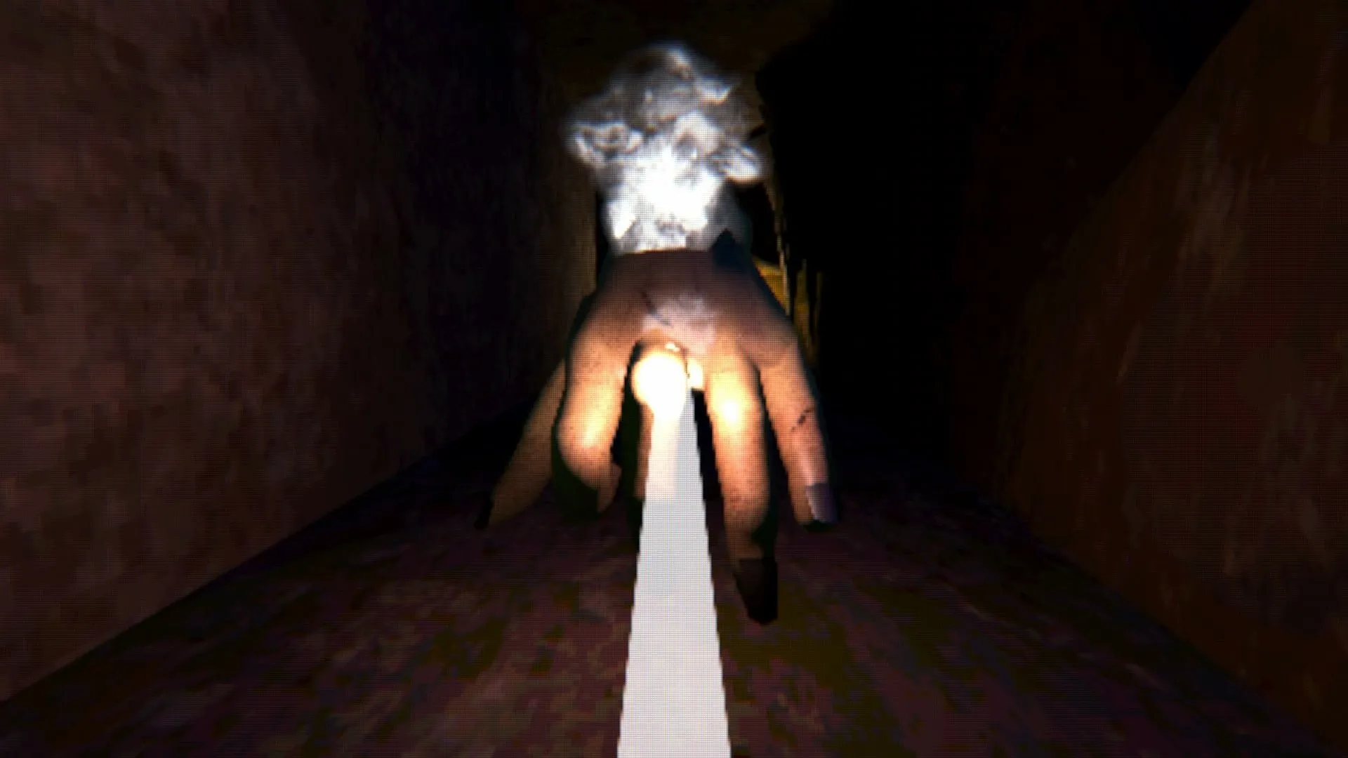 HOLES: A giant hand emerges from the darkness, illuminated by a flashlight in a narrow tunnel.