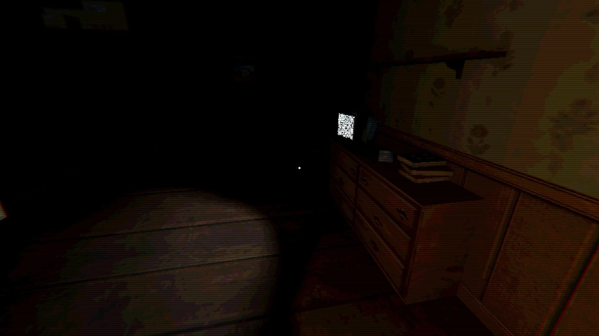Hotel of Seams: First-person view facing a static-filled TV on a dresser in a dark hotel room.