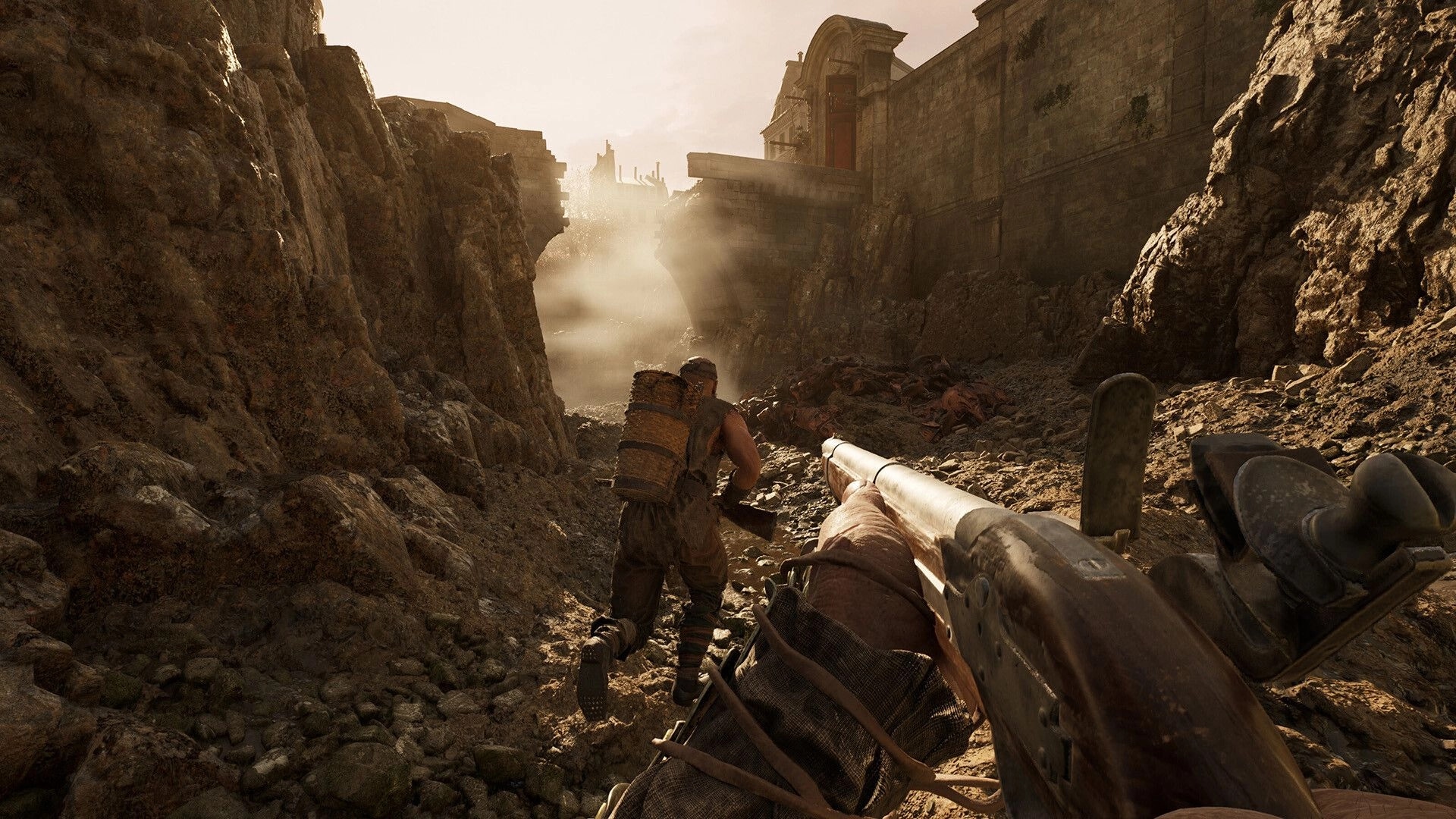 HUNGER: First-person shotgun aimed at ally with backpack running through rocky ravine by stone walls.