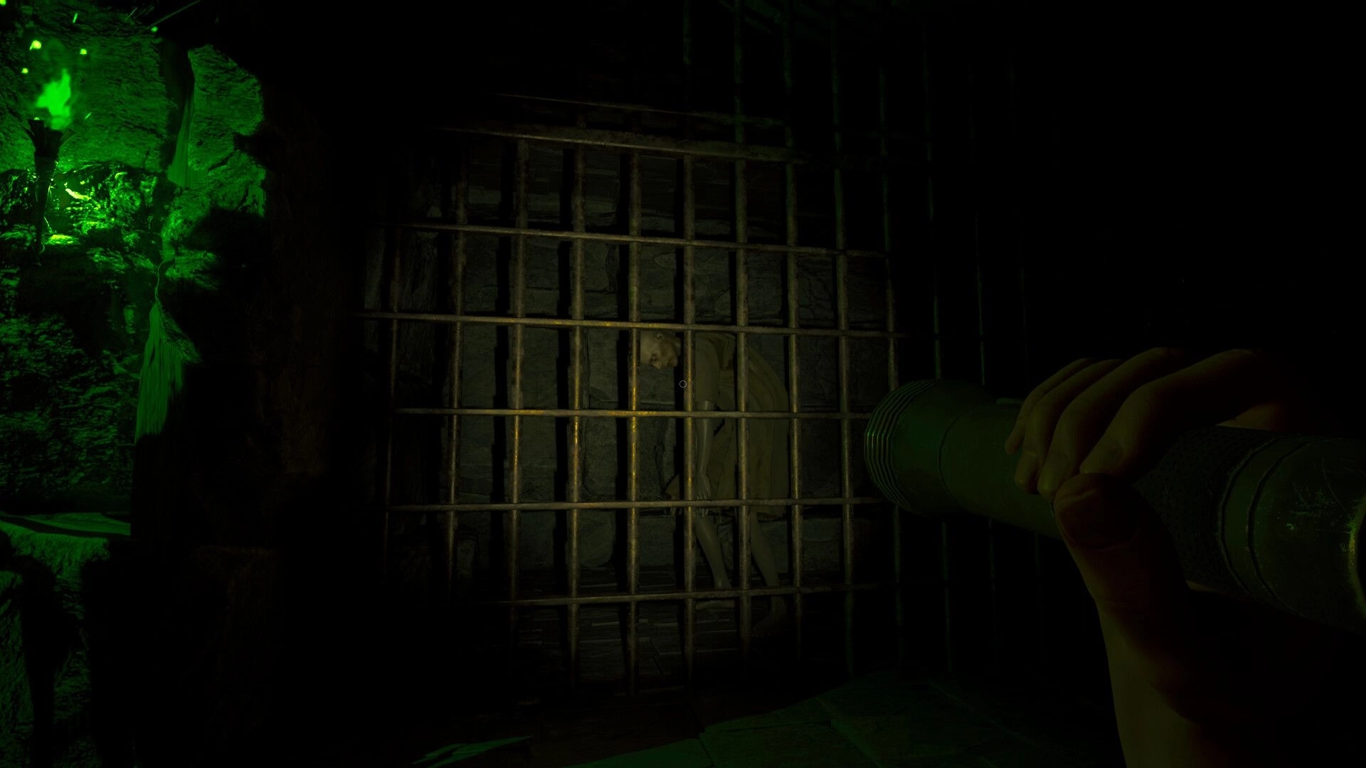 In Vino Veritas: Flashlight view of a barred jail cell with a slumped body in a dark corridor.
