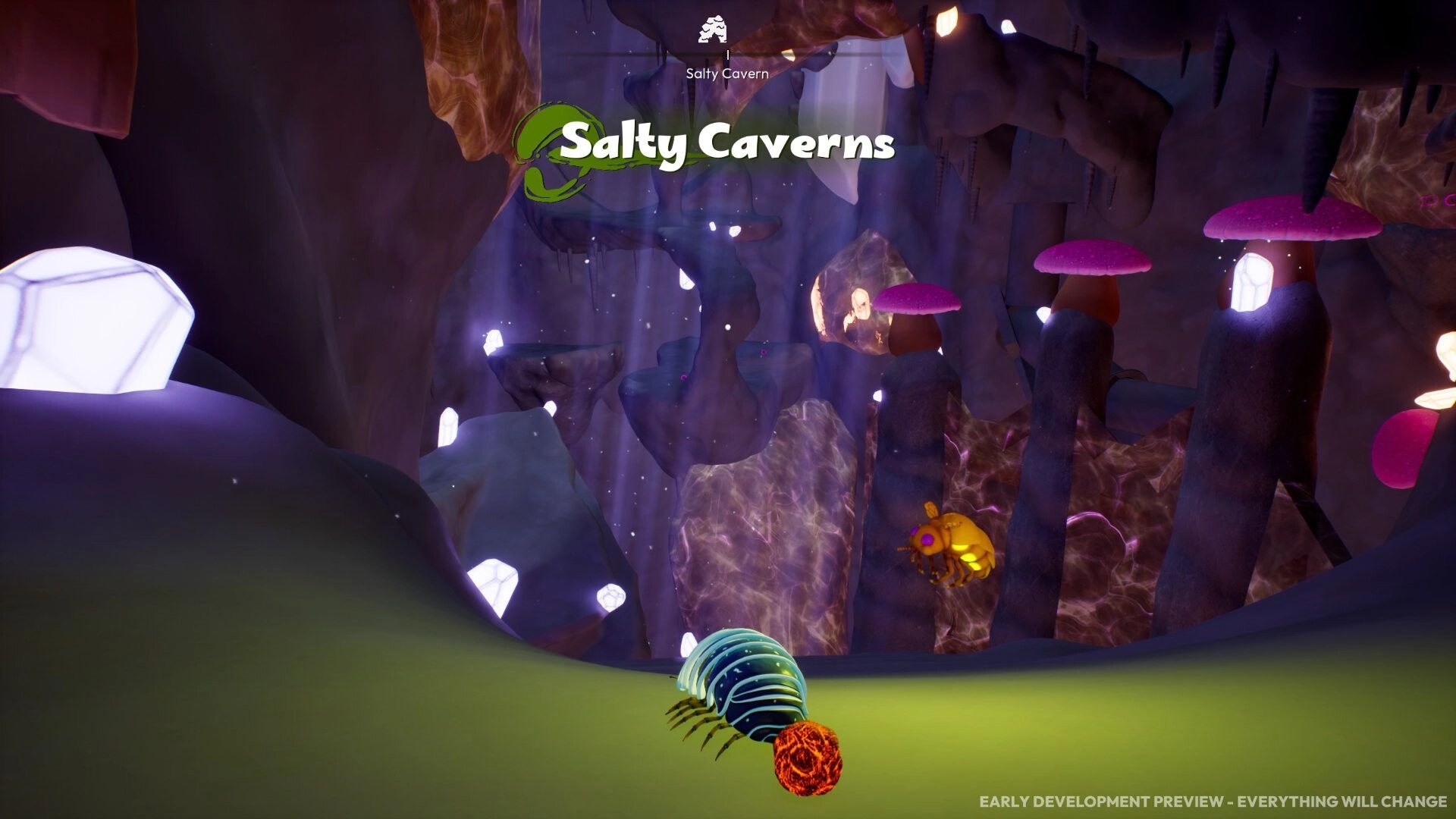 Incredibug: Pill bug pushes a glowing red orb in Salty Caverns with crystals and mushrooms ahead.