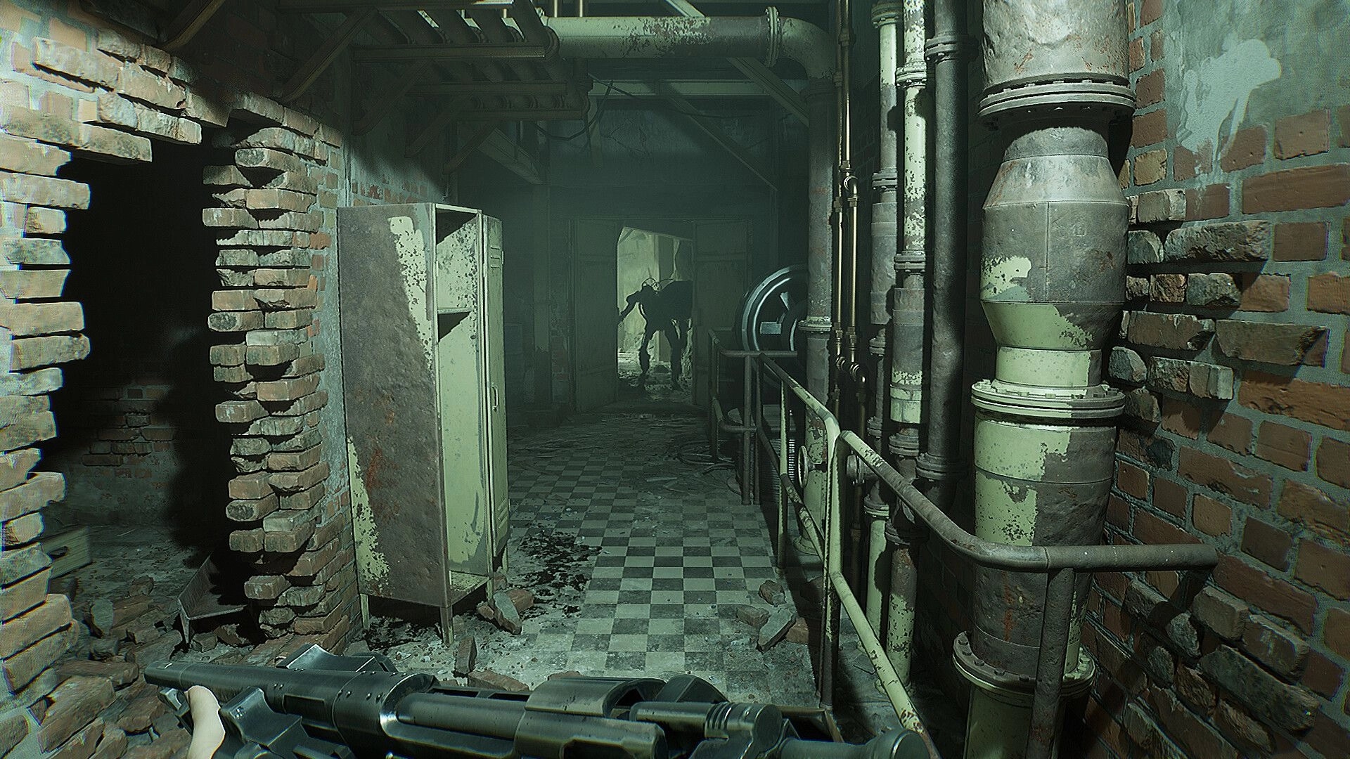 INDUSTRIA 2: Player aims weapon in dim corridor with lurking shadowy figure, surrounded by brick walls.