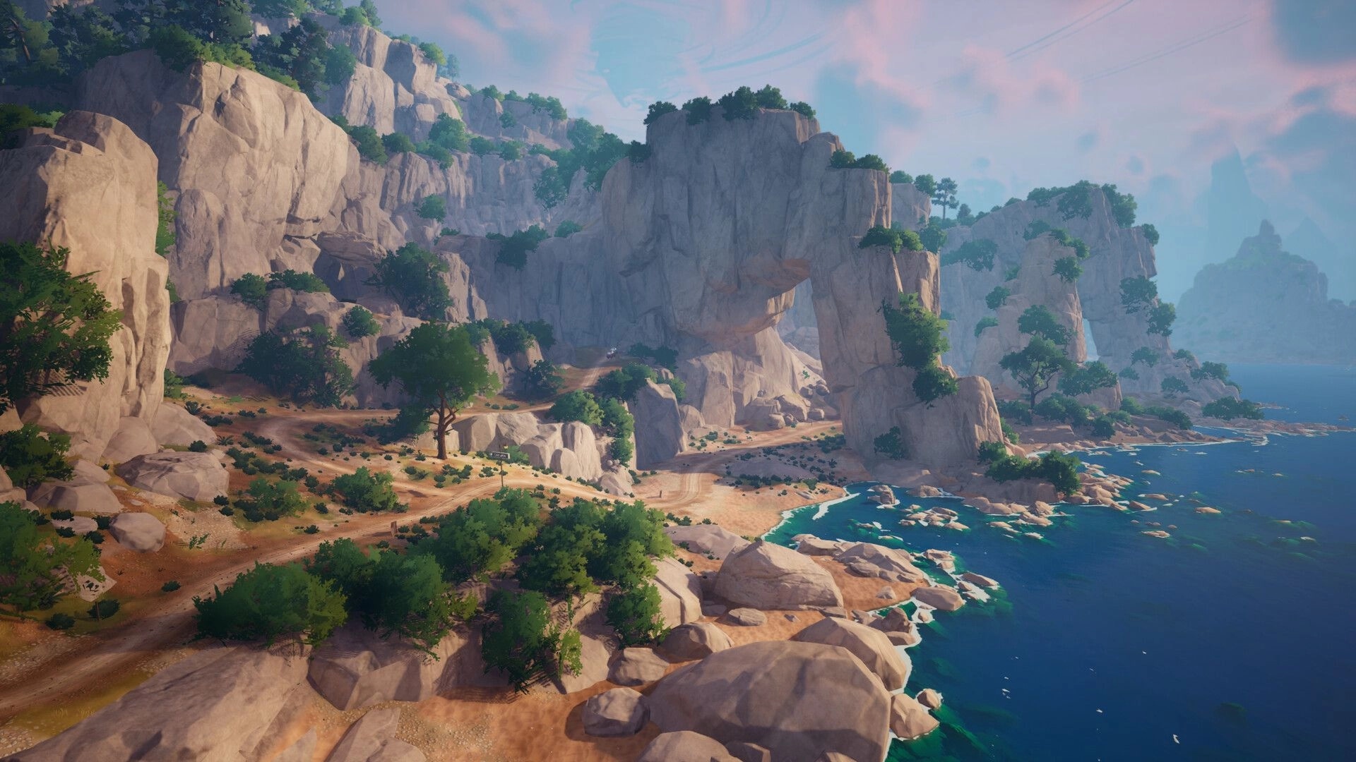 Into the Wind: Winding dirt road through towering sea cliffs and trees beside a bright blue shoreline.