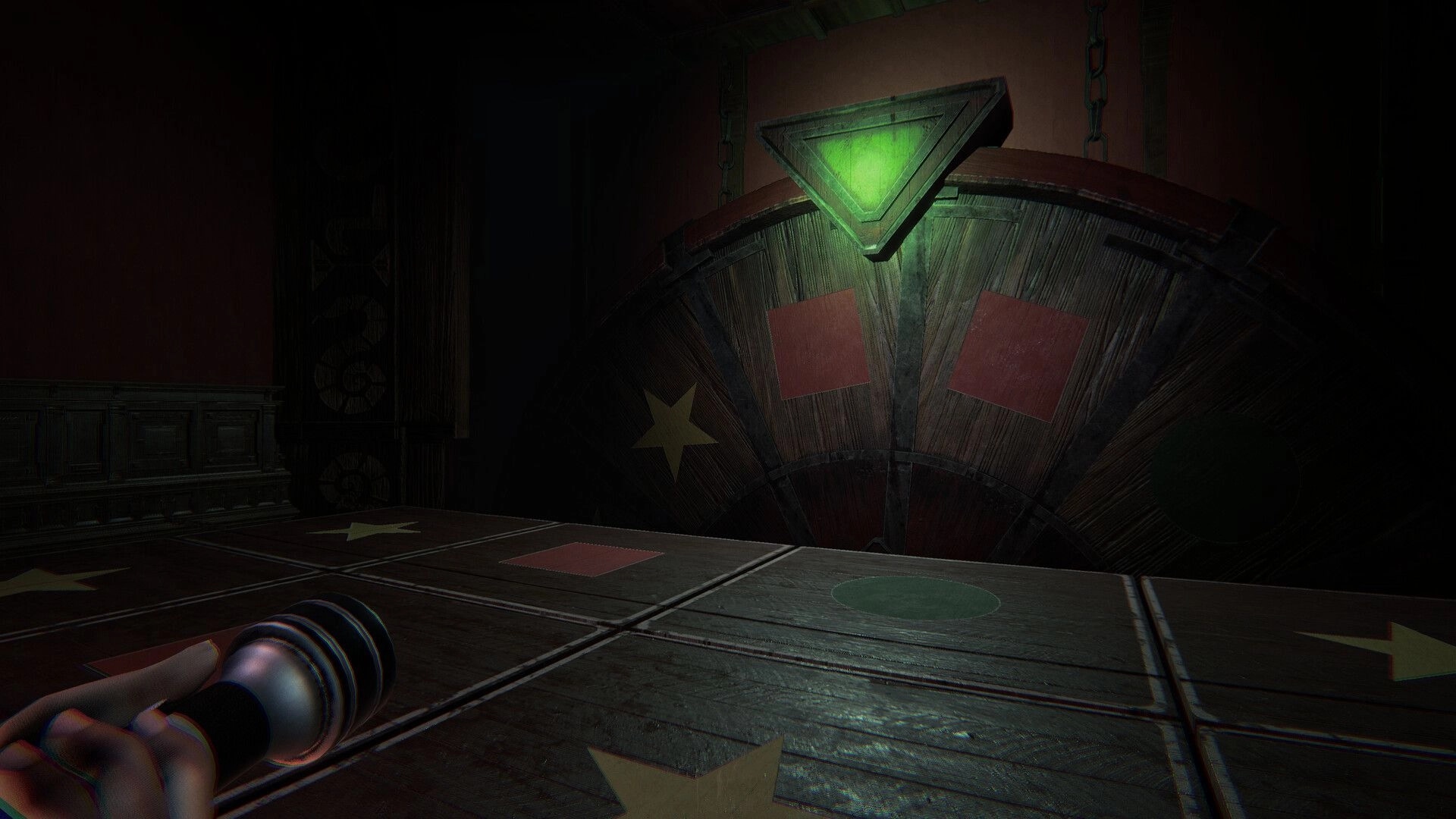 Invokyr: First-person view aiming flashlight at a giant wooden wheel and board tiles in dim room.
