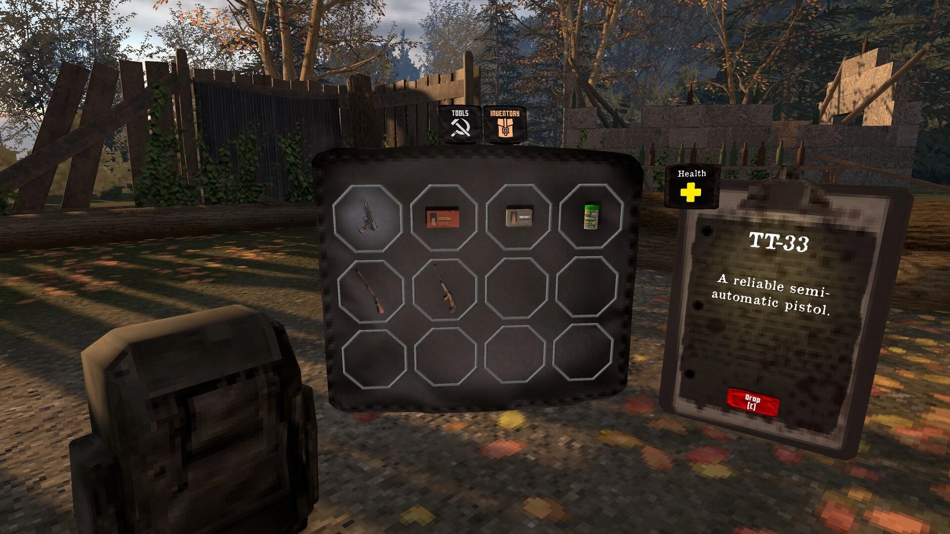 Iron Blight: Inventory menu with pistol, ammo, and health item open in a fenced autumn yard.
