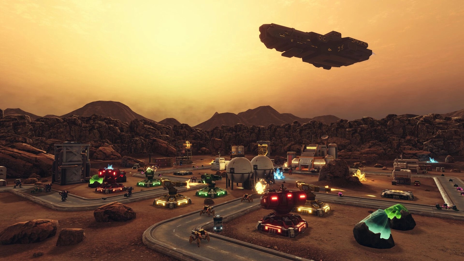 IRON GUARD: Base with turrets and robot units under a sunset sky, mountainous terrain in the background.