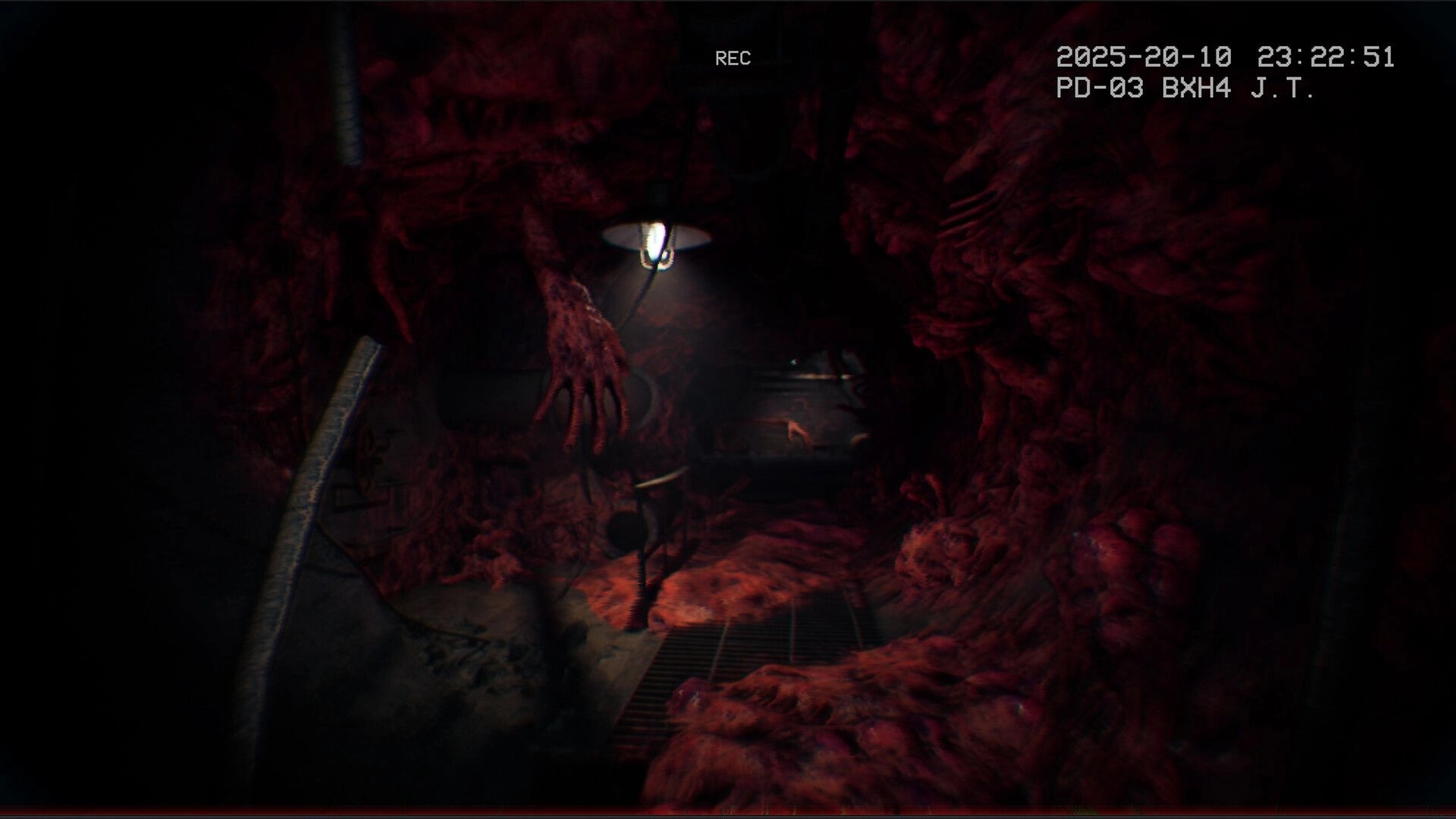 It Reaches: Grotesque hallway with fleshy walls and eerie lighting in abandoned hospital basement
