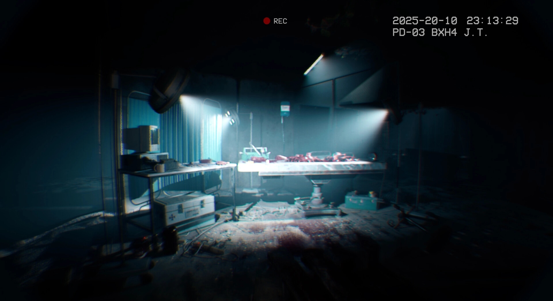 It Reaches: Examination room with surgical table and scattered medical equipment in dimly lit hospital.