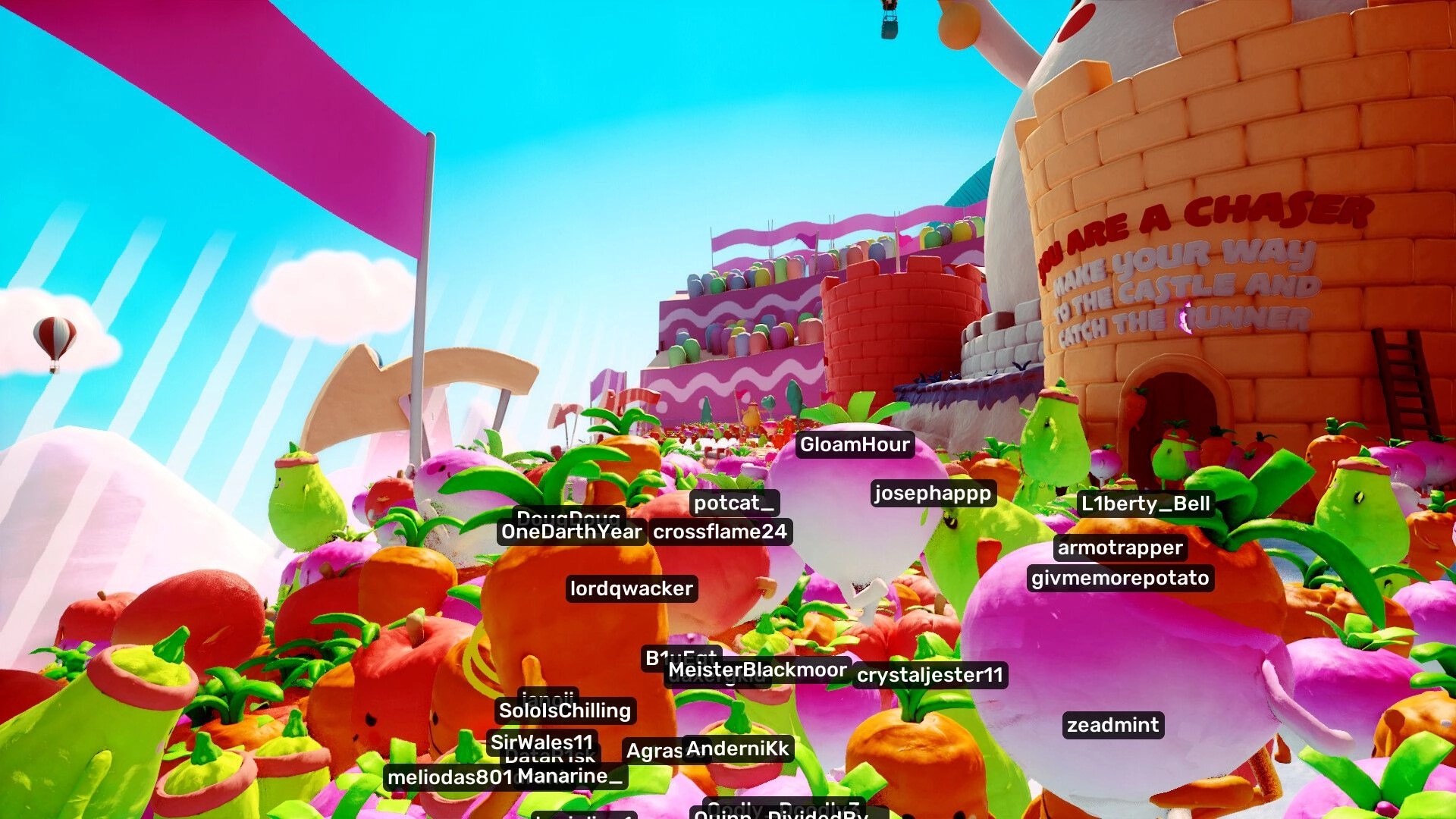 Jitter Games: Colorful vegetable characters race toward a candy castle in a vibrant landscape.