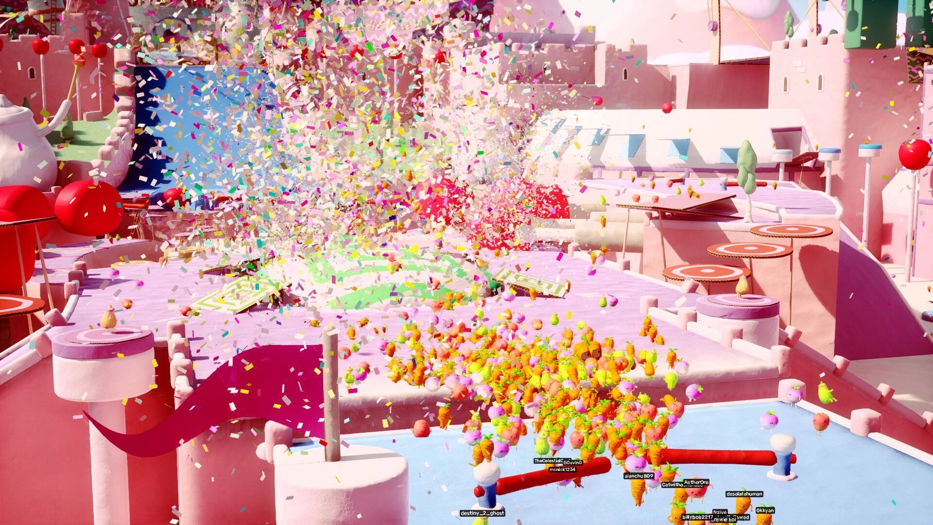 Jitter Games: Colorful confetti explosion in candy-themed obstacle course with player avatars navigating