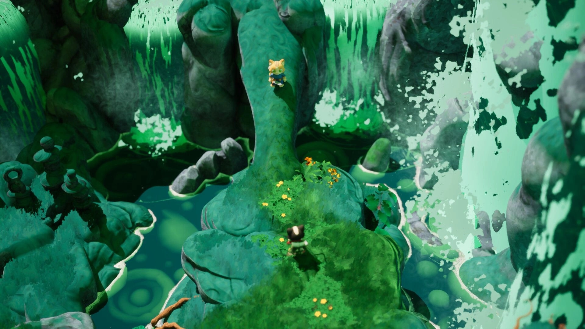 Kali and Ko: Two small explorers on mossy rock ledges beside a roaring waterfall in a lush cavern.
