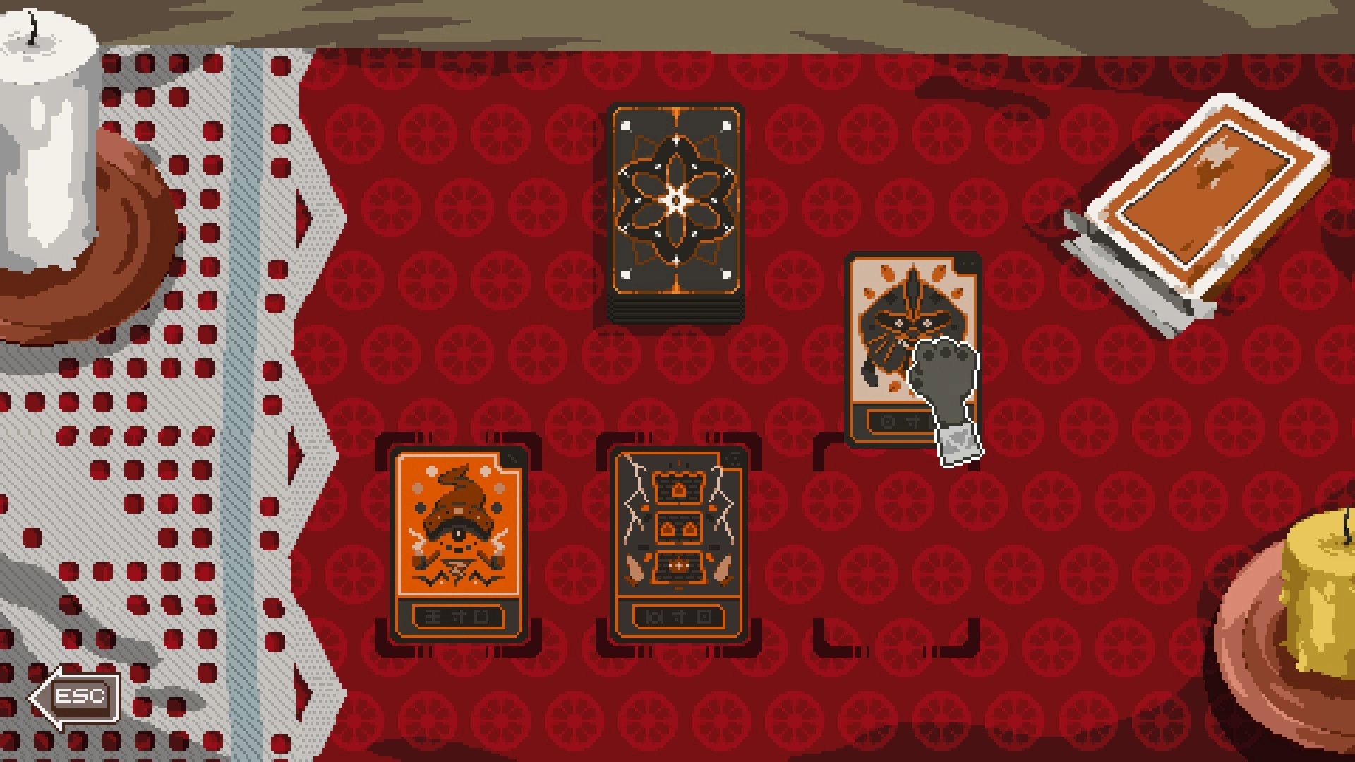 Kambulin: Card selection screen on a red patterned table with candle and deck of cards visible