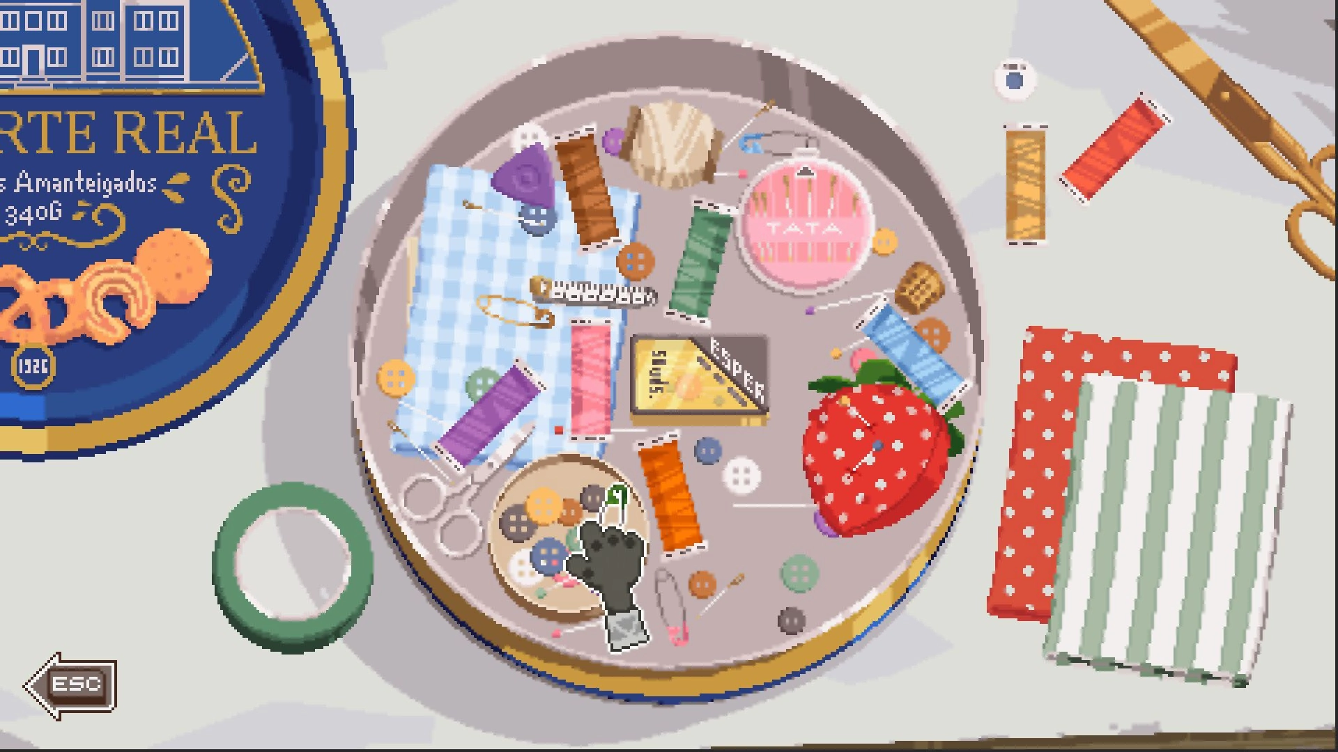 Kambulin: Overhead view of sewing kit with threads, buttons, scissors, and strawberry pincushion.