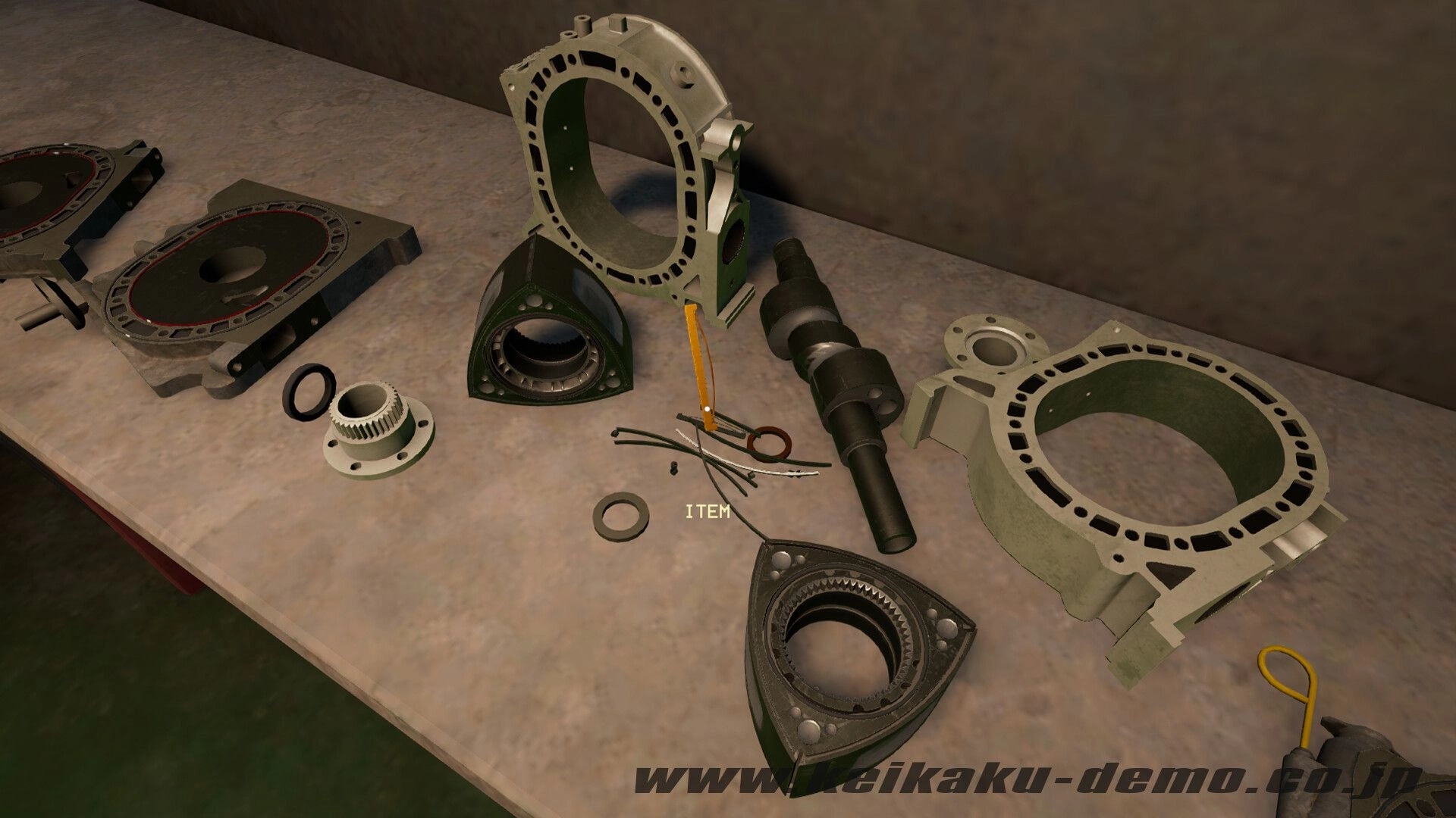 Keikaku計画: Rotary engine parts laid out on a workbench with ITEM prompt in a garage workshop.