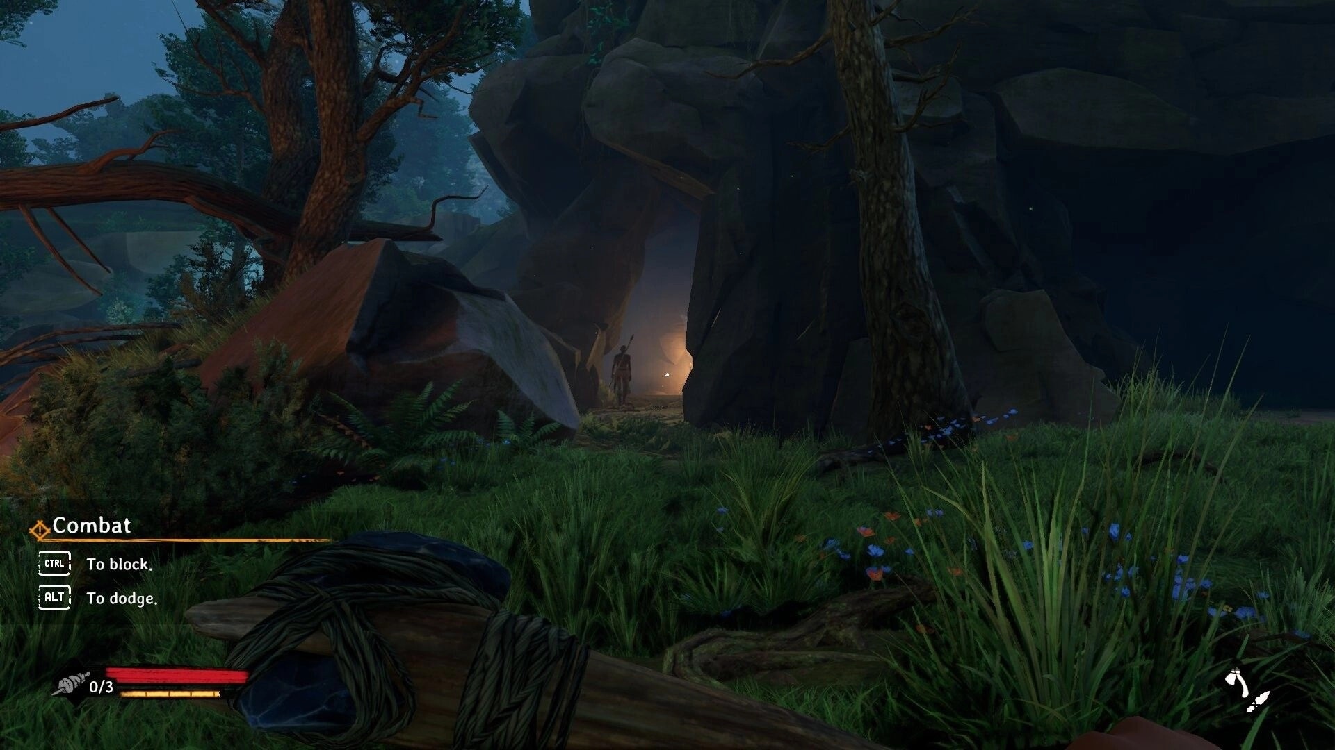 Kiipluu: Combat tutorial HUD as Kiipluu crouches in grass facing cave entrance in forest rocks.