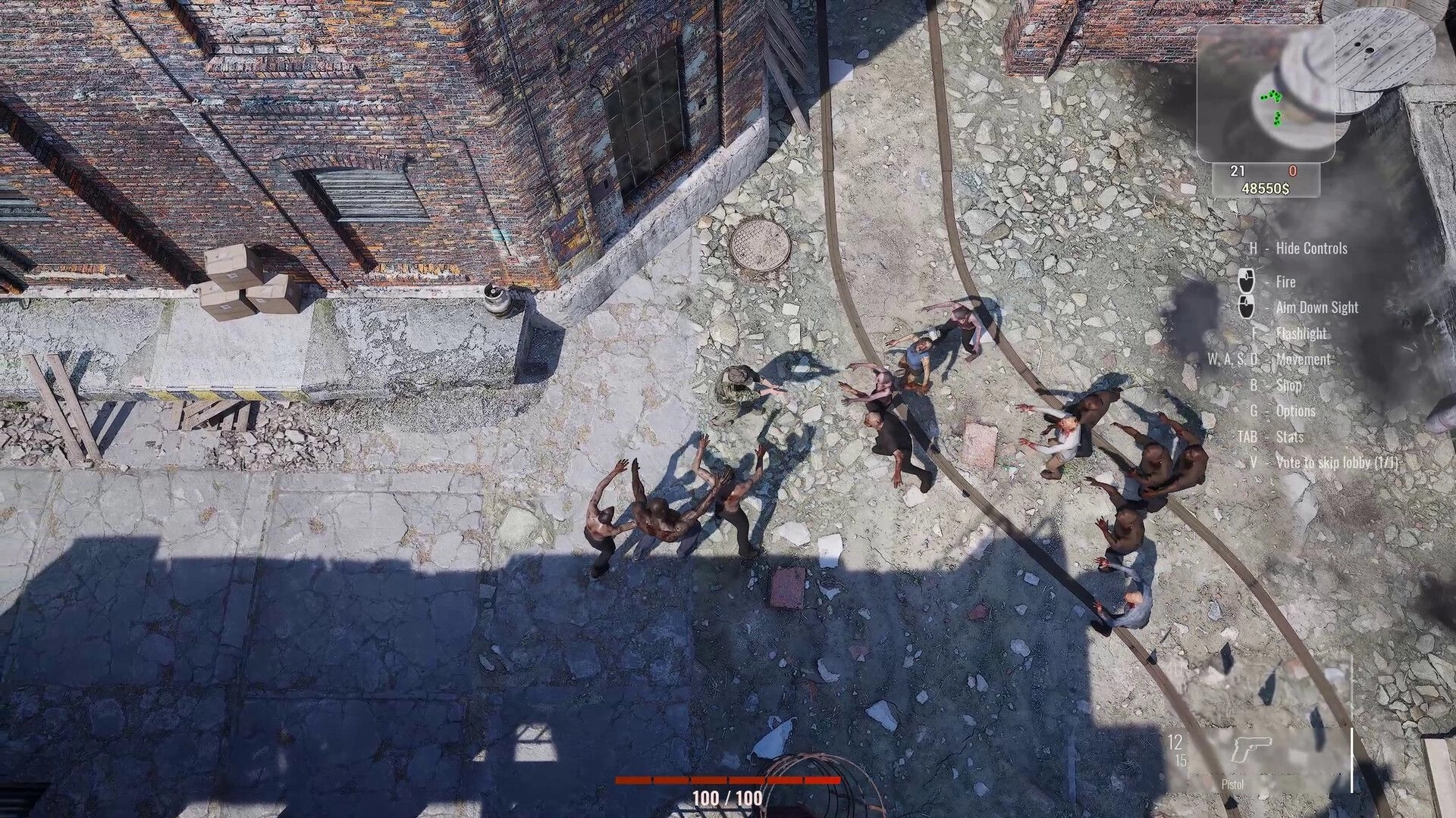Killing Dead: Top-down view of player battling zombies in urban alley with control hints on screen