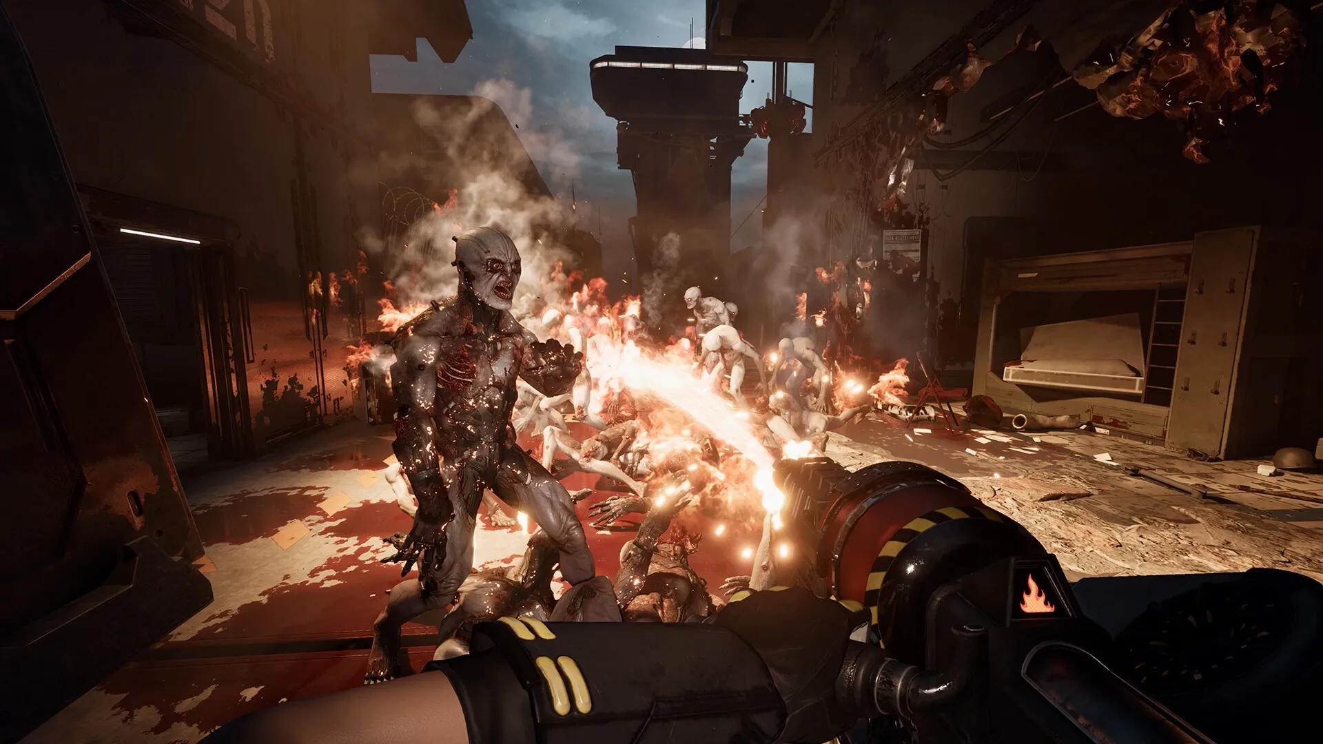 Killing Floor 3: Player using flamethrower against zeds in a dark, industrial corridor setting.