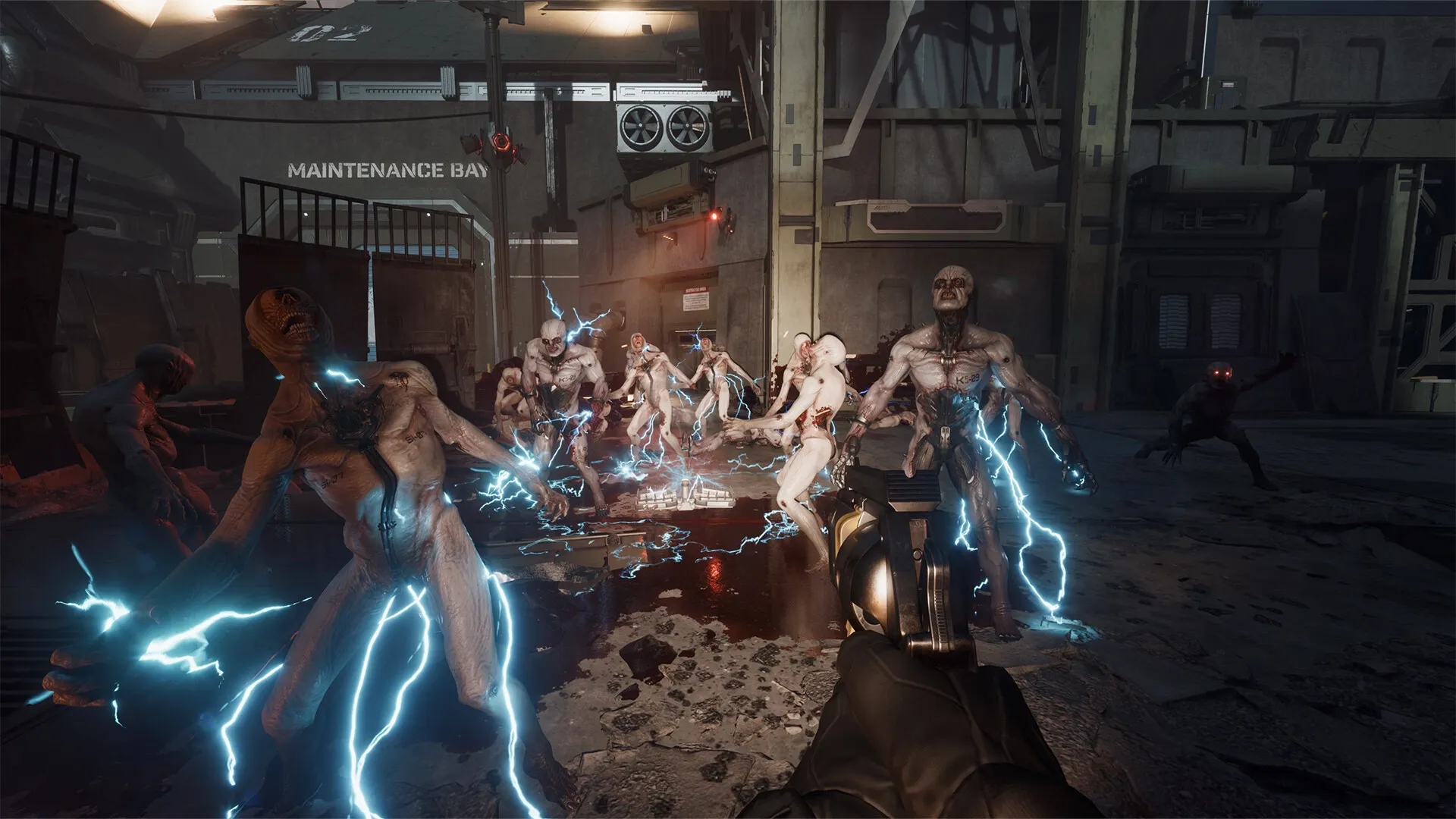 Killing Floor 3: Player aims at electrified zeds in a dark maintenance bay environment
