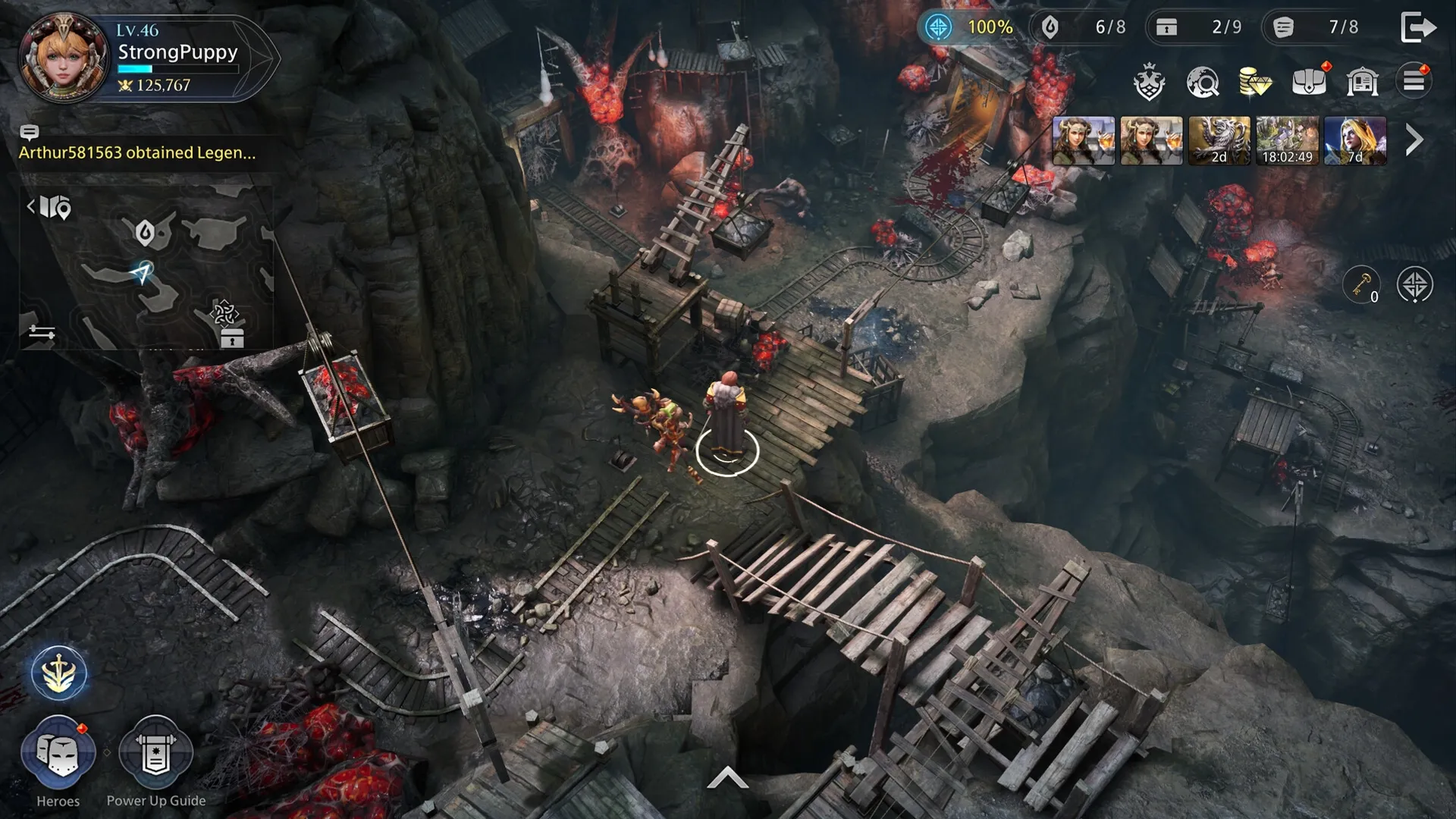 King Arthur: Characters exploring a perilous cave with wooden bridges and rocky terrain in a top-down view.