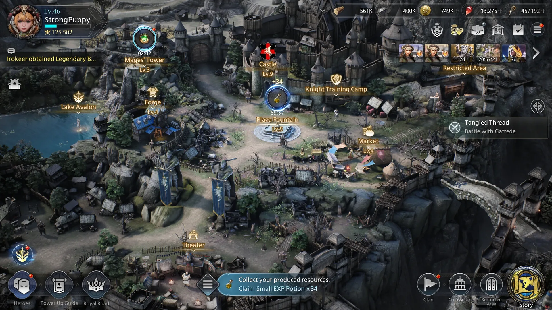 King Arthur: Overhead view of kingdom with Castle, Mages' Tower, and Plaza Fountain in bustling village.