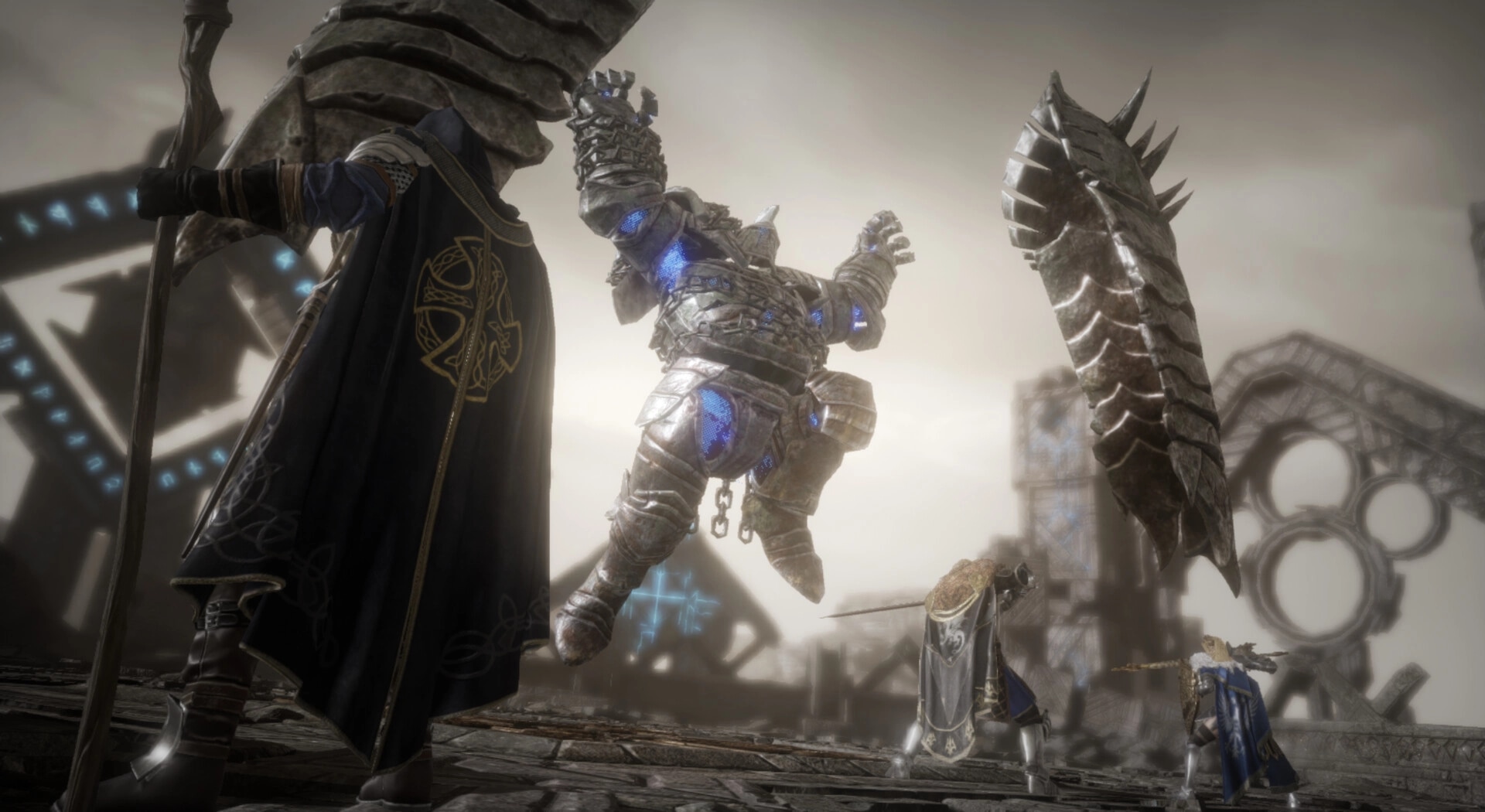 King Arthur: Battle against a giant armored golem in a desolate, ancient ruins with three heroes engaged.