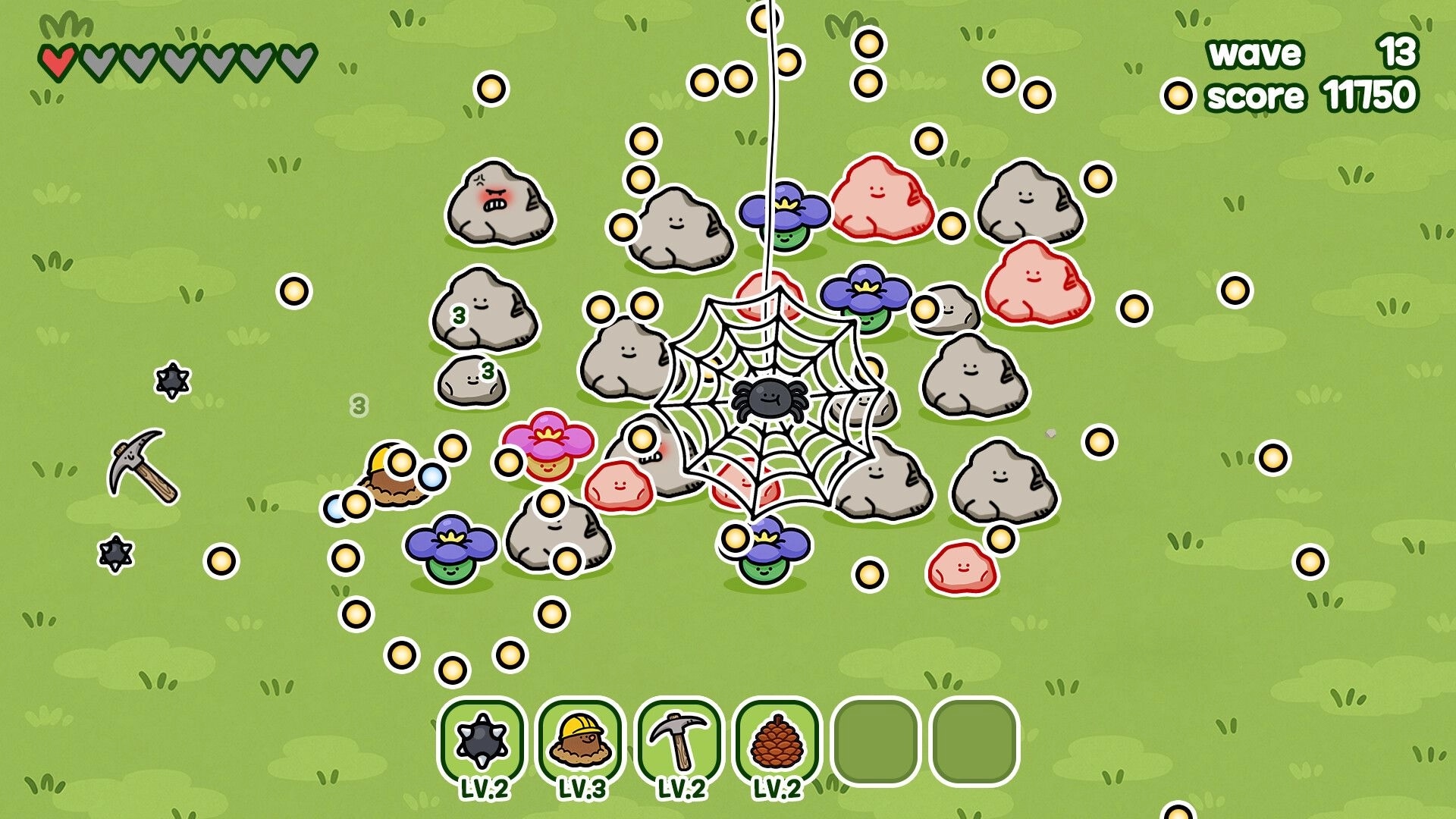 King of Pickaxe: Spider web trap amid smiling rocks and coins on grassy field, wave 13 HUD.