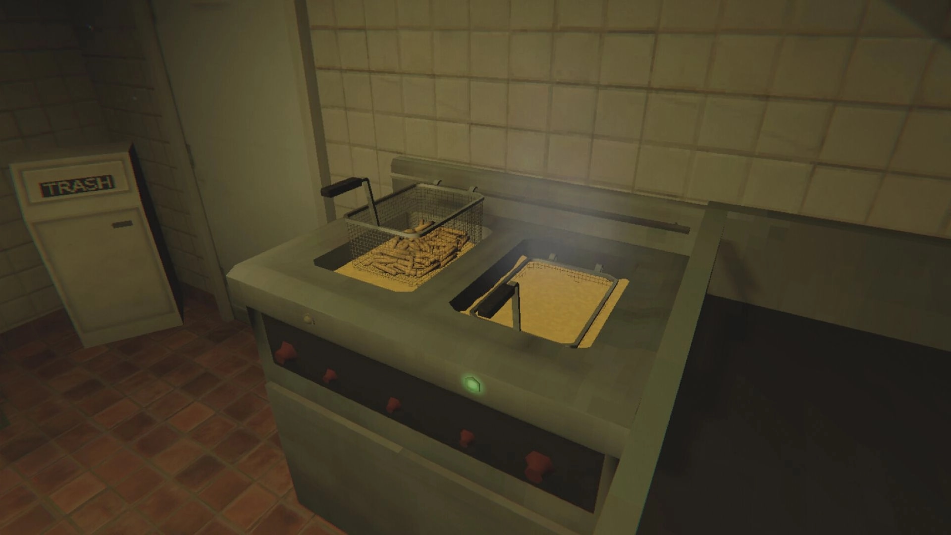 Kiosk: Fryer with fries and oil in a dimly lit, tiled kitchen area with trash bin nearby