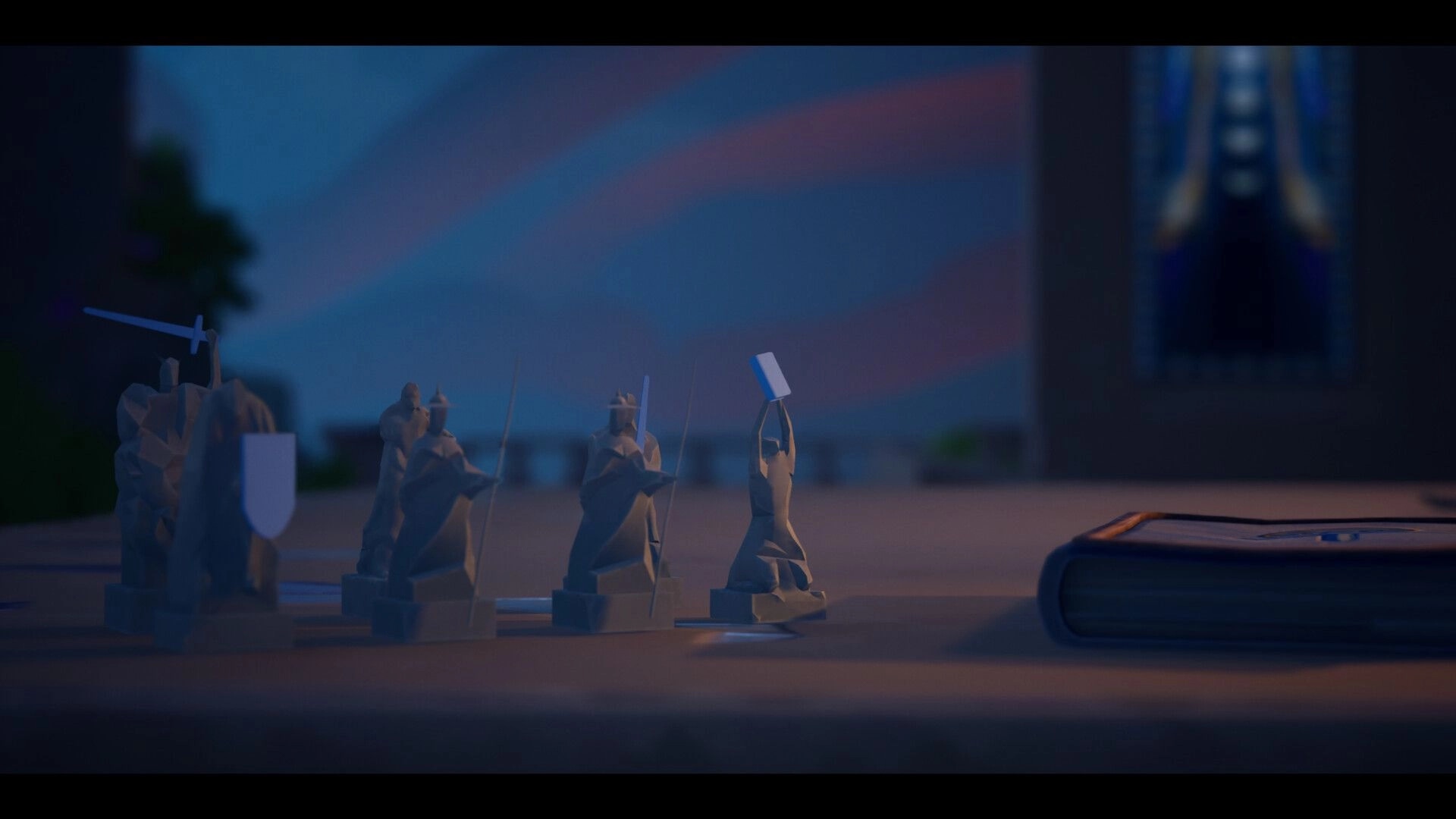 Knightstones: Miniature knight and spear units set on a war table beside a deck of cards in camp.