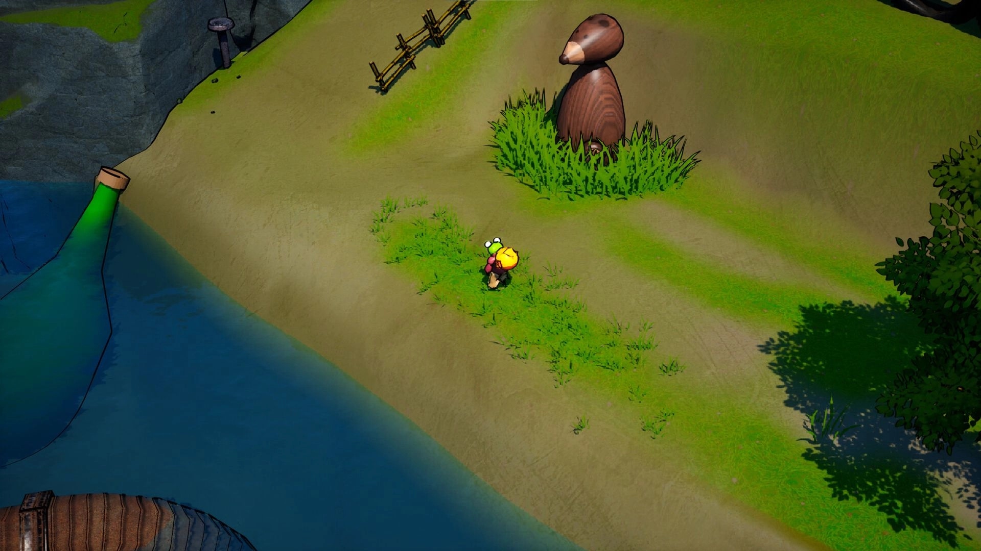 Kodoktale: Tobo explores grassy riverbank with large wooden statue and green water flowing from pipe