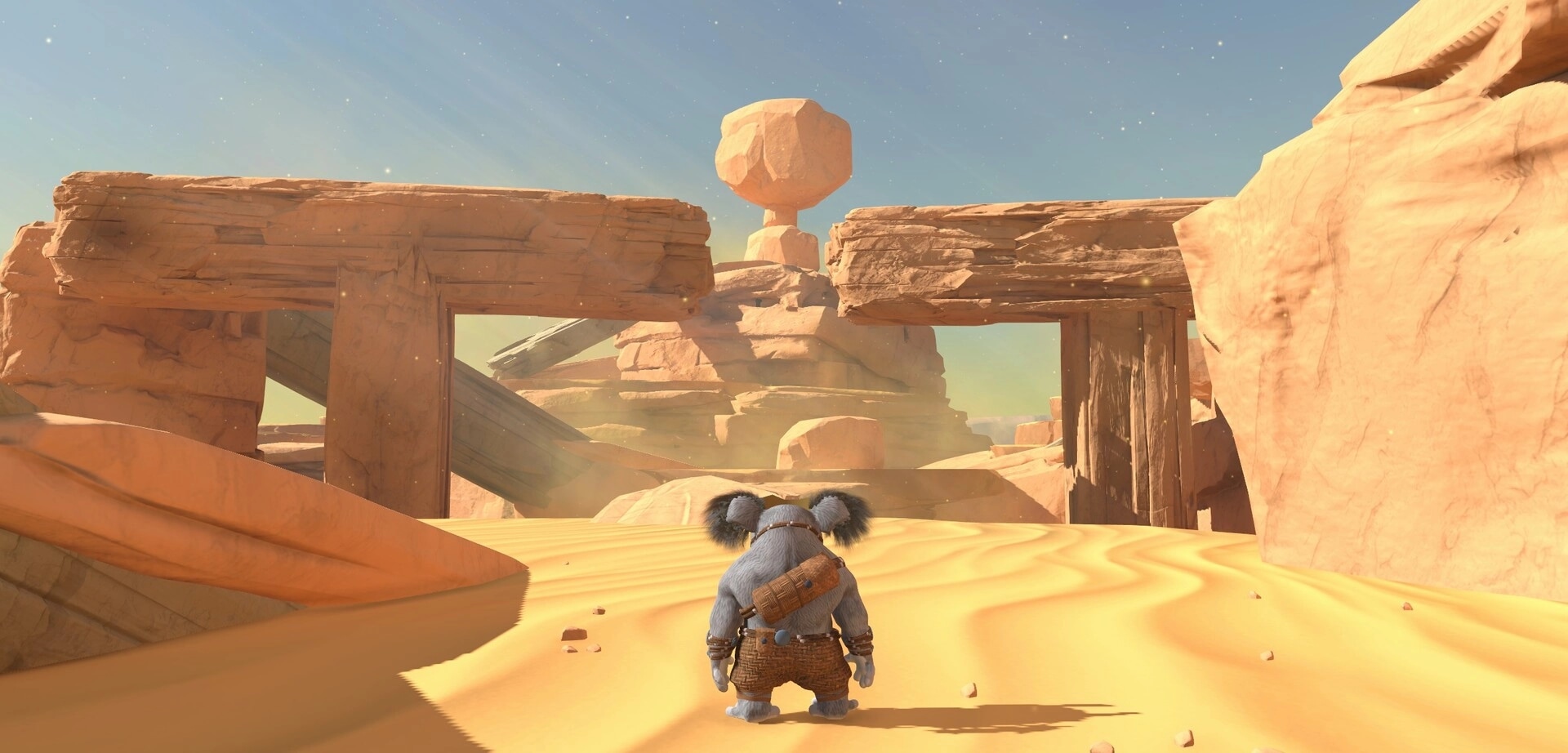 Koromi: Third-person view of a koala explorer facing sandstone arches in a sunlit desert canyon.