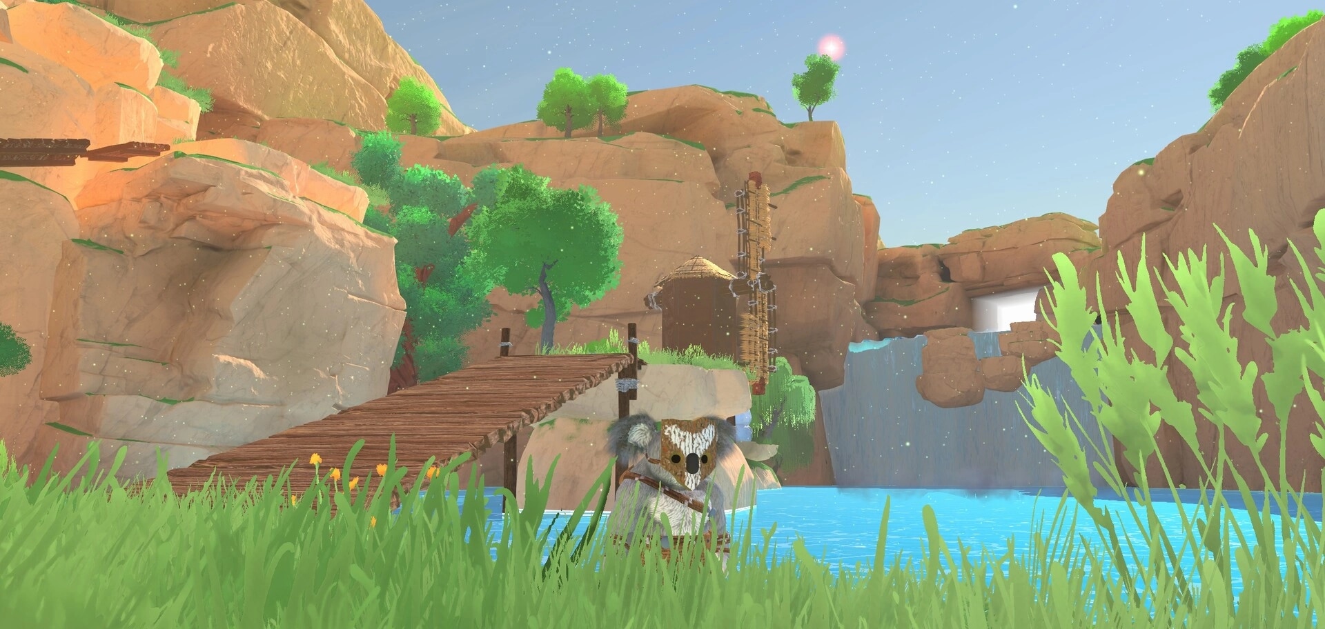 Koromi: Small owl-like character by a riverbank near wooden bridge, cliffs, and a waterfall pool.