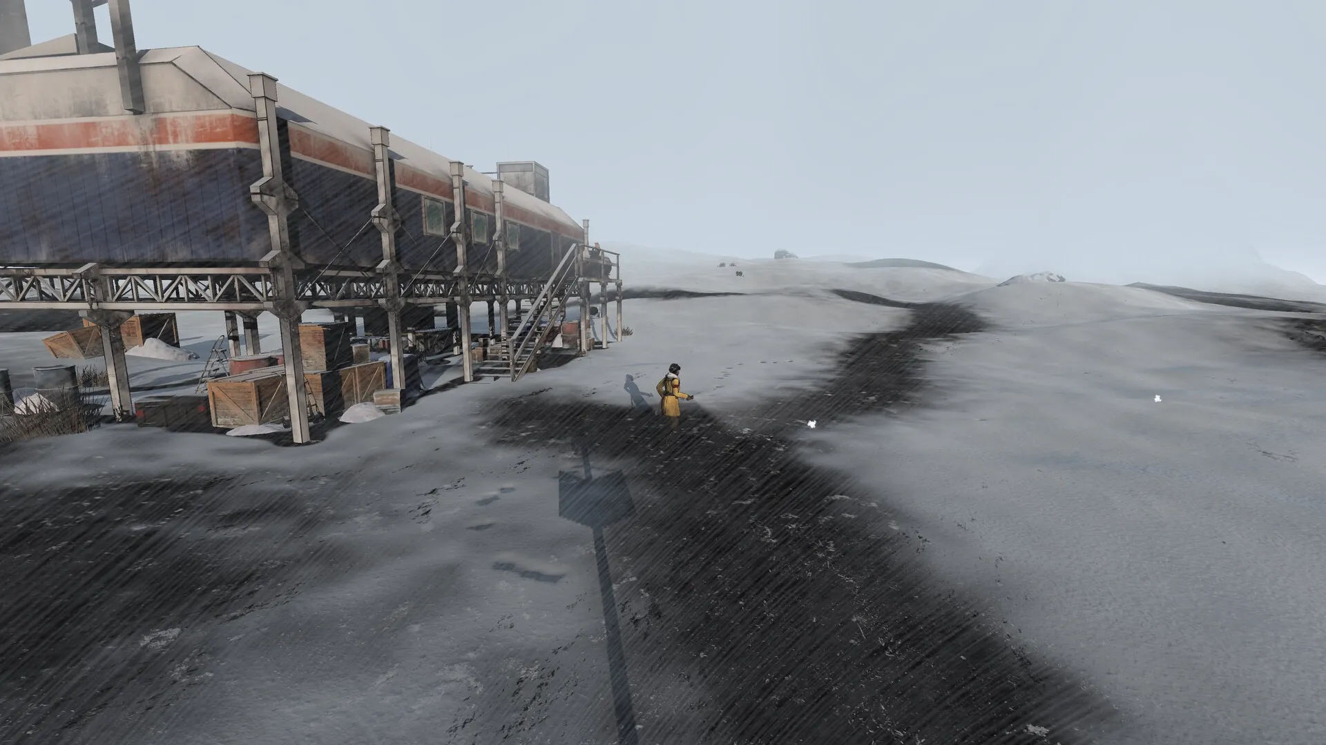 Kriophobia: Lone character explores snowy terrain near an abandoned military base with scattered crates.