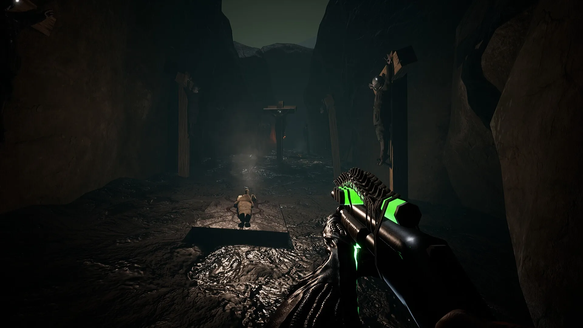 KVLT: First-person view aiming at ritual site in dark cavern with crucified figures on stone walls