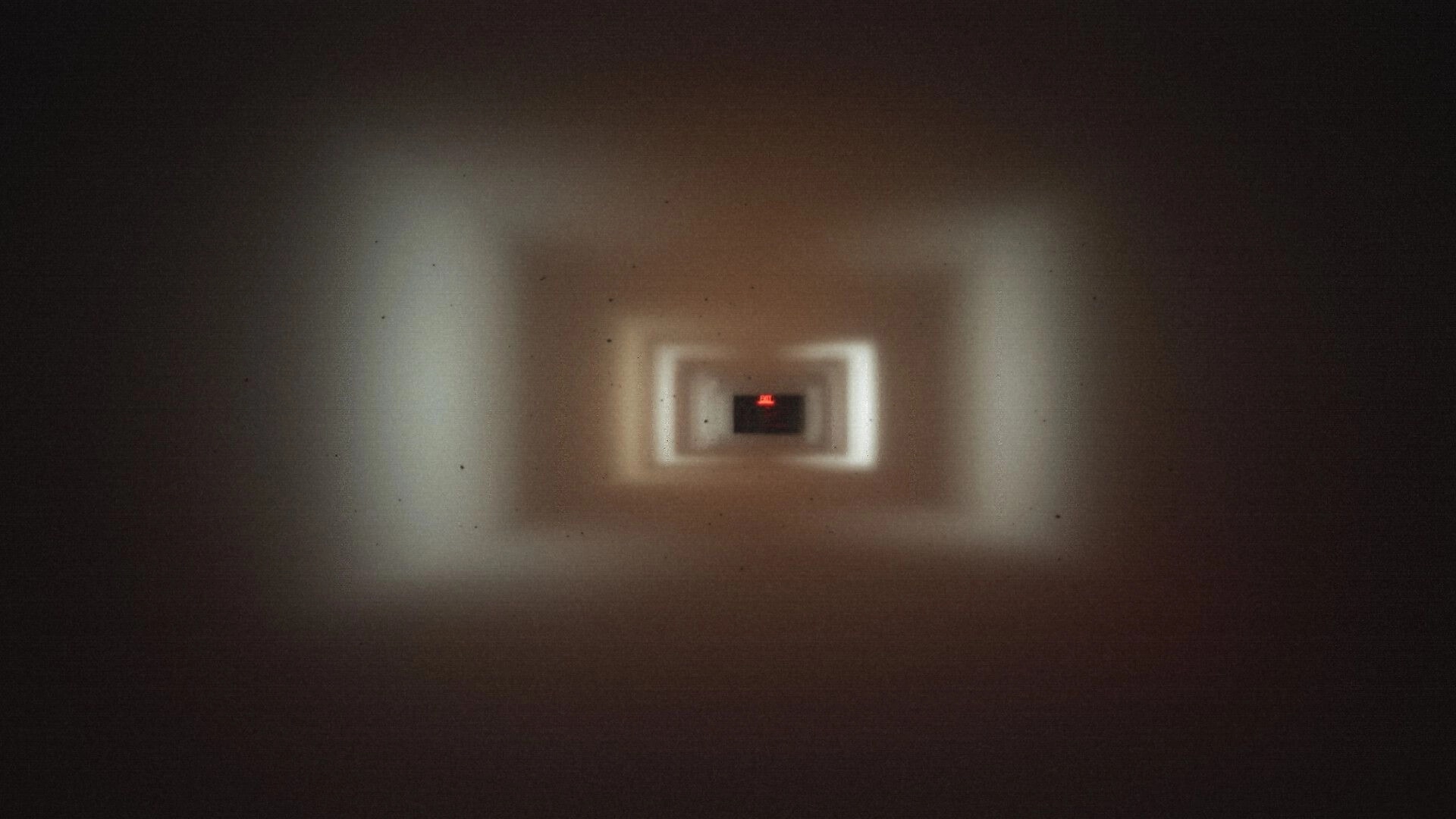 Late Shift: Blurry first-person view down a long hallway toward a glowing red EXIT sign in darkness.
