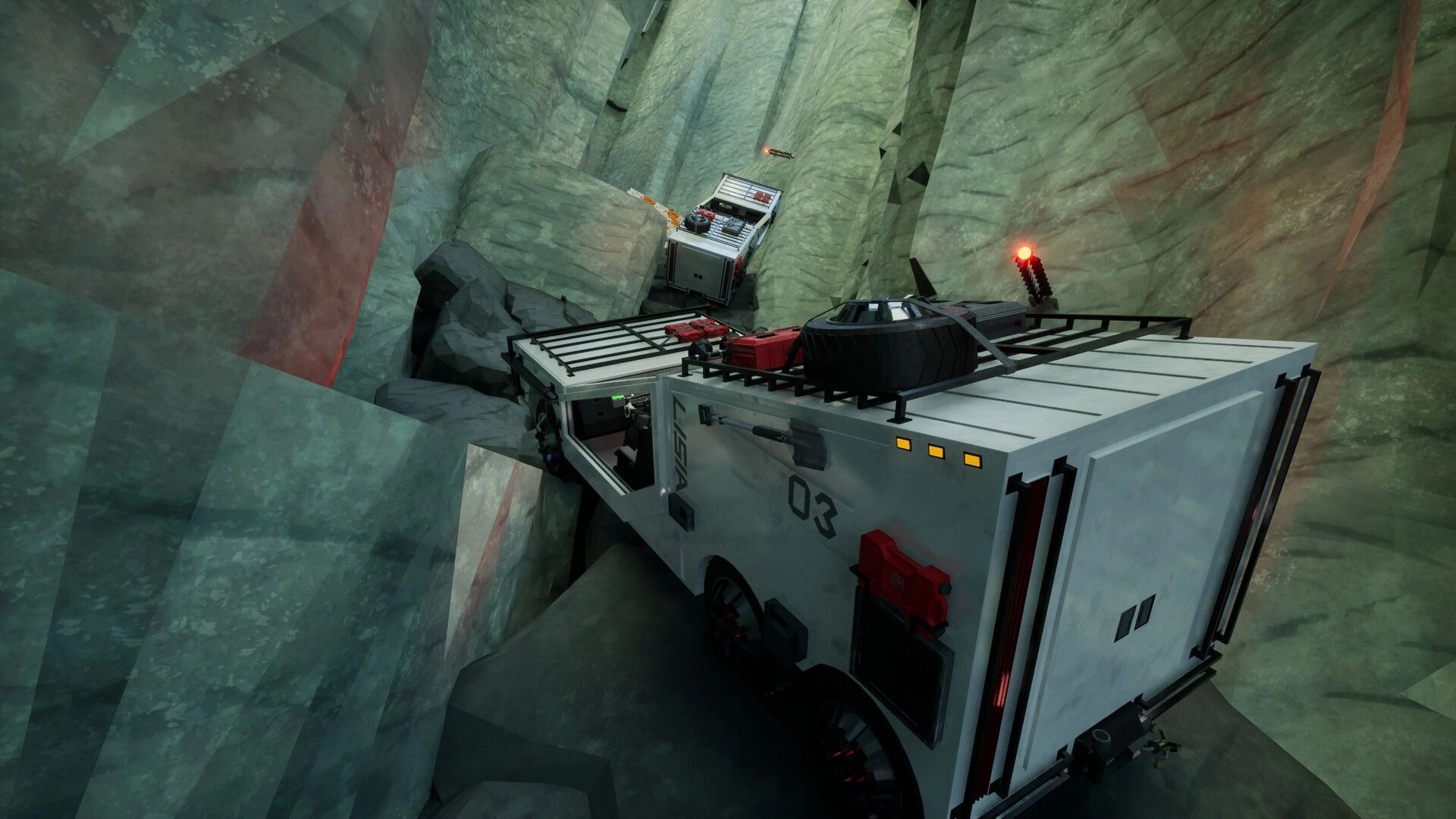 LISIA: Two utility trucks wedged on a narrow canyon ledge with red beacons and roof gear visible.