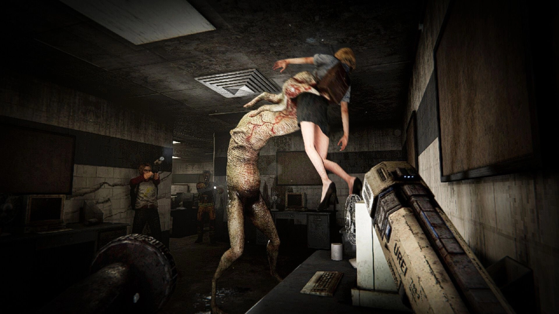 LIVING HELL: Mutant creature lifts a woman overhead as teammate aims flashlight in dark office lab.