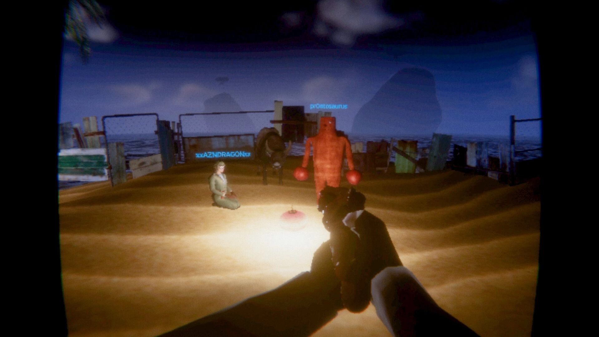 Loading...: First-person gun aimed at avatars on a sandy arena with player name tags and props.
