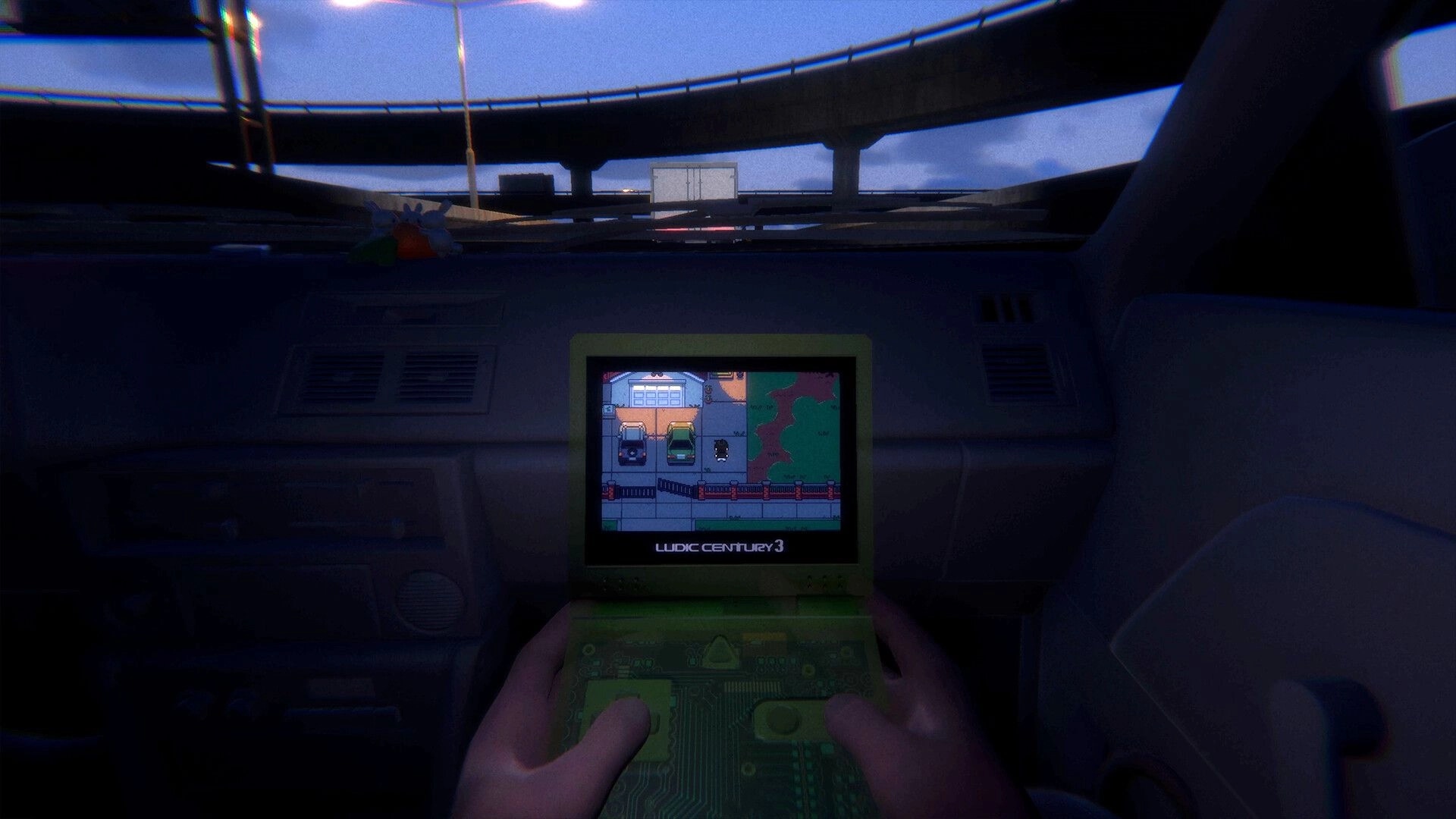 Loading...: Hands hold a handheld game playing a top-down scene inside a parked car under overpass.