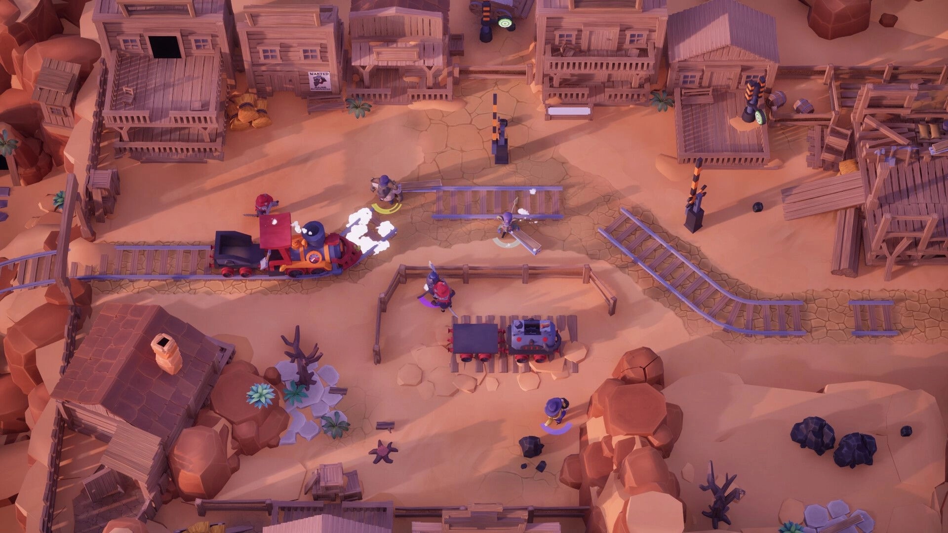 Loco: Players lay track as a steam train rolls through a dusty western town with wooden buildings.