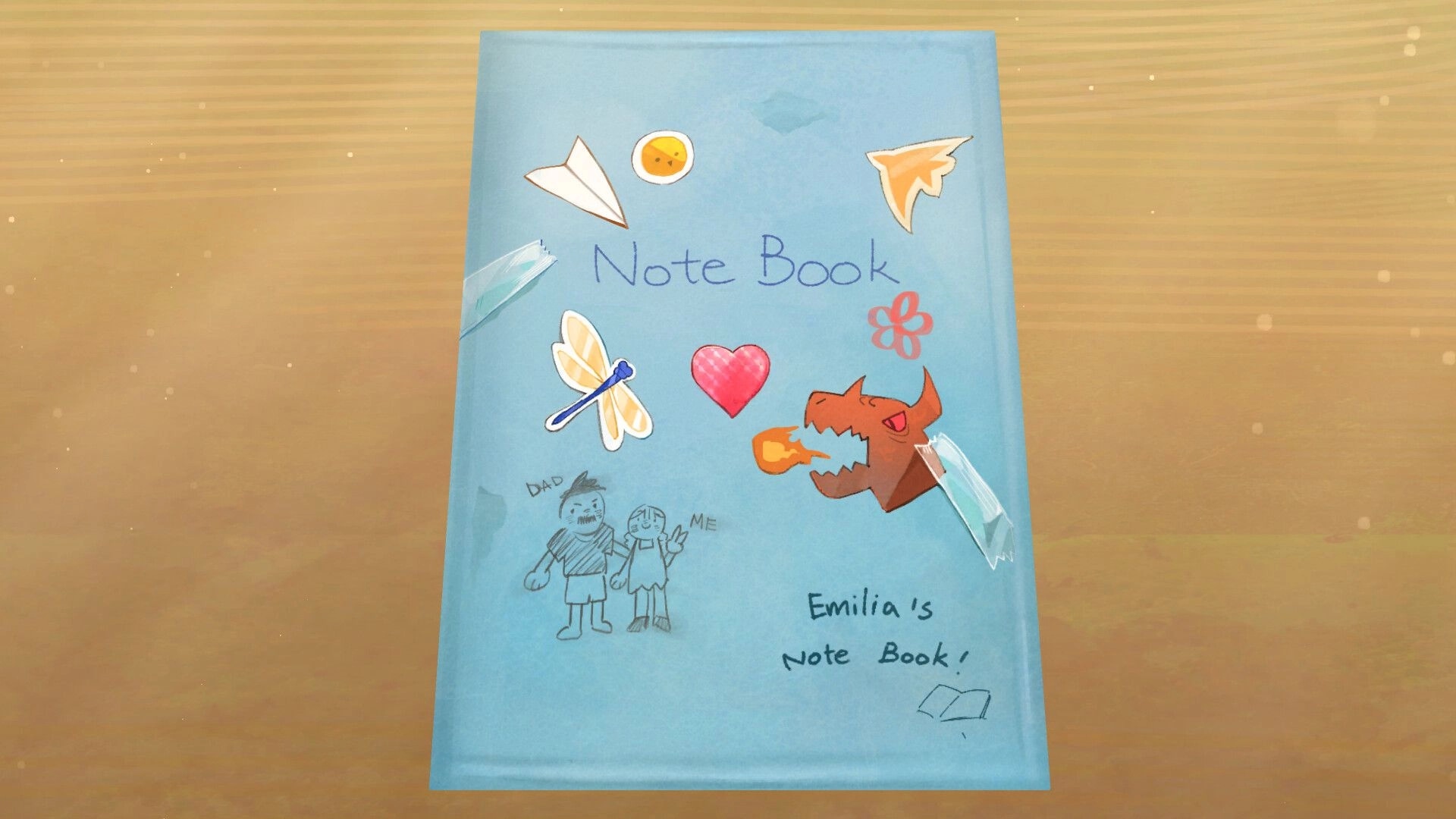 Looking Up: Emilia's decorated notebook cover with drawings of dragon, butterflies, and paper plane