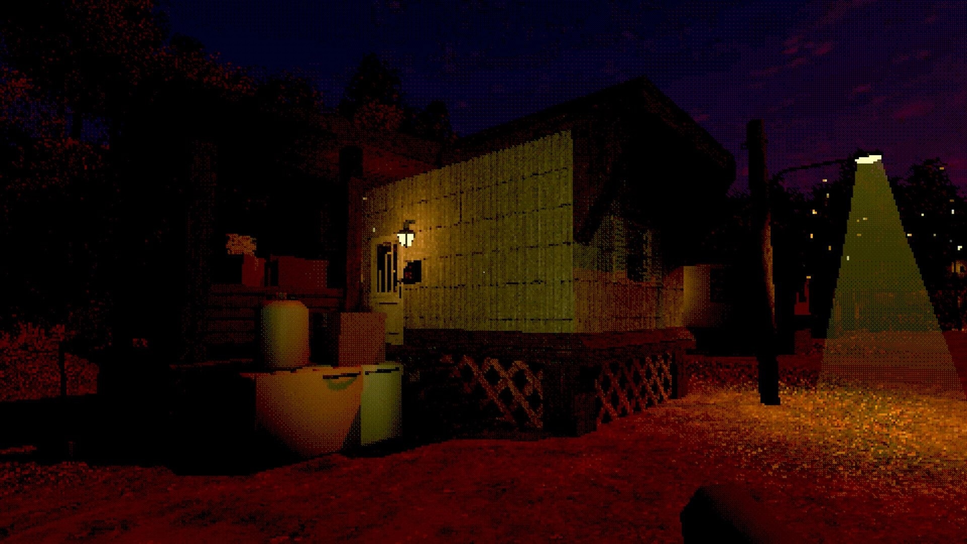 Loveland: Nighttime view of a trailer home lit by porch lamp, with bins and yard under streetlight.