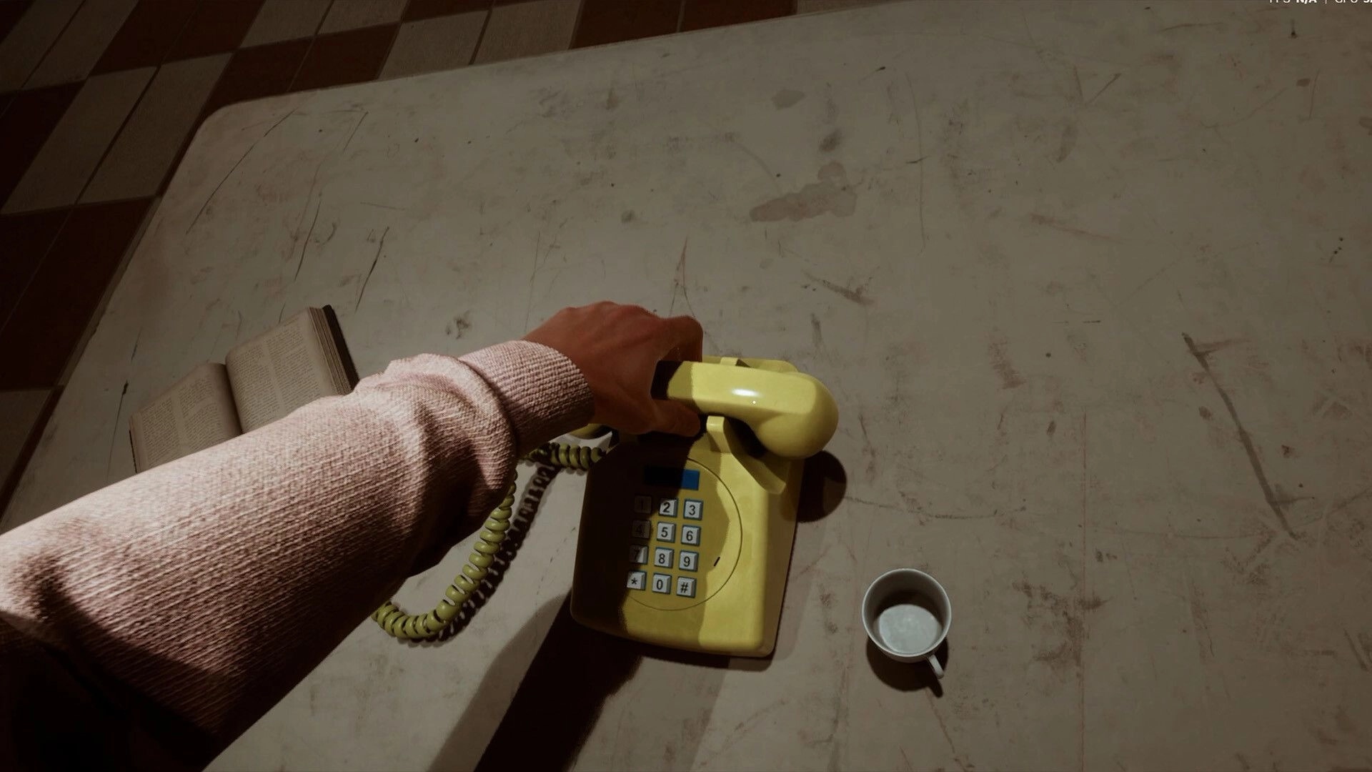 LUCID: First-person hand lifts a yellow corded phone on a stained table beside a book and mug.