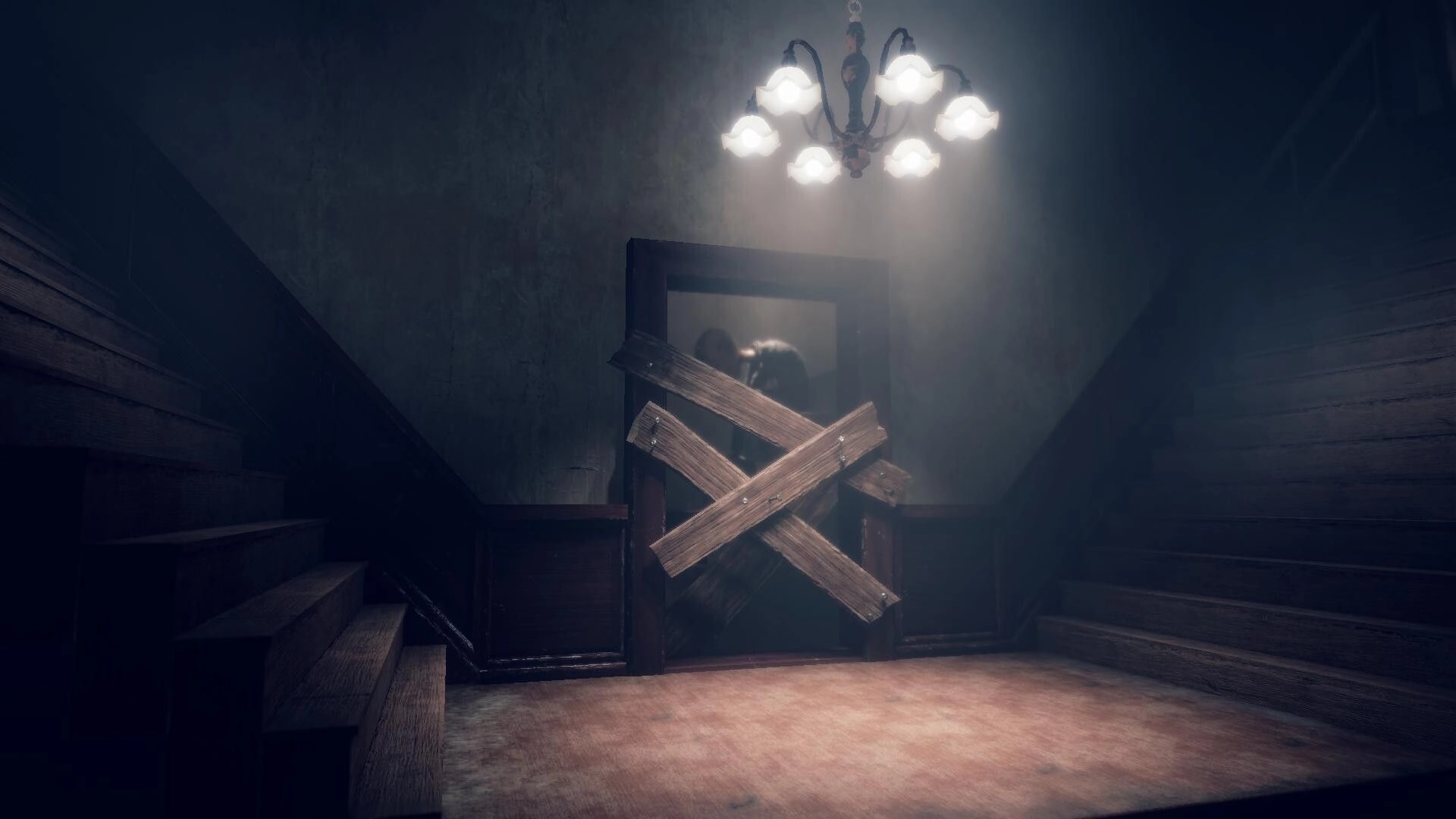 Lull: Boarded-up door with crossed planks under chandelier in a dim stairwell hallway.