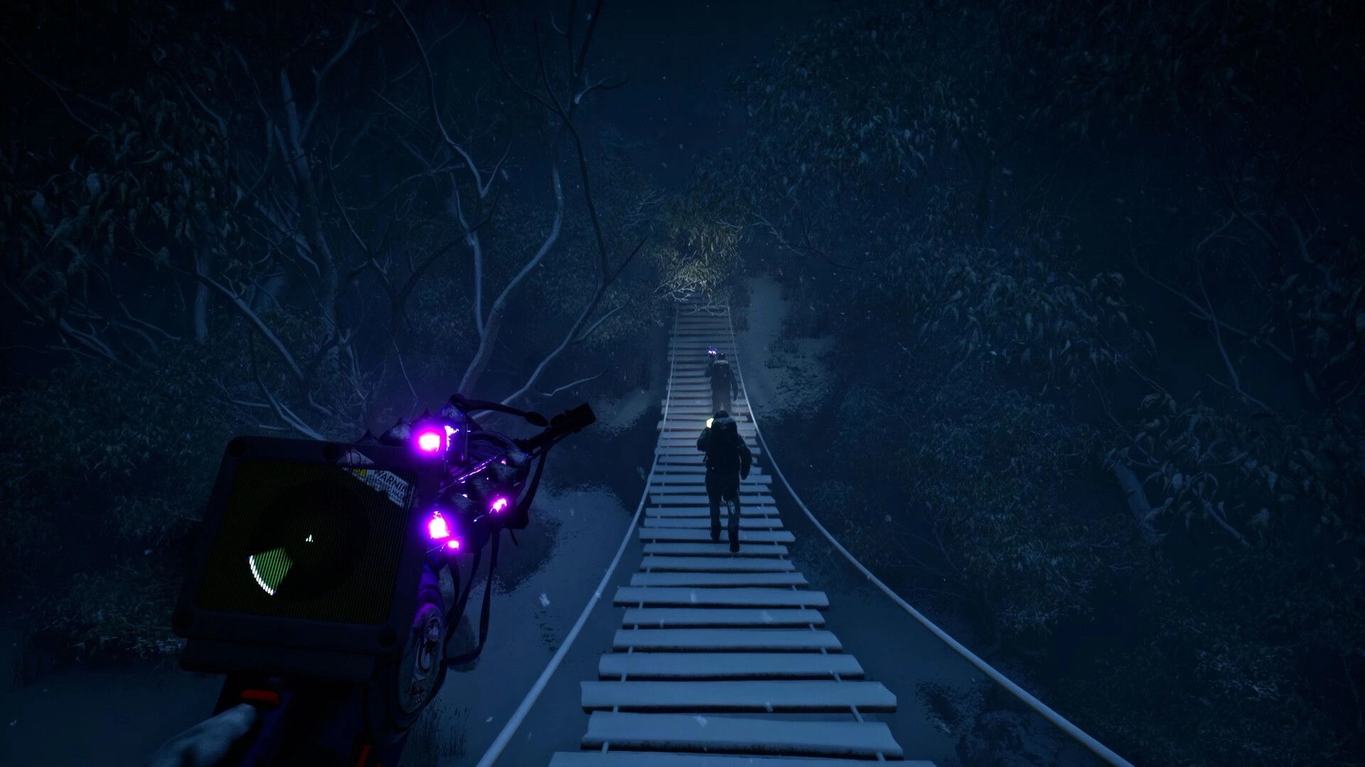Macabre: Two characters cross a narrow, snowy bridge in a dark forest using a gadget with purple lights.