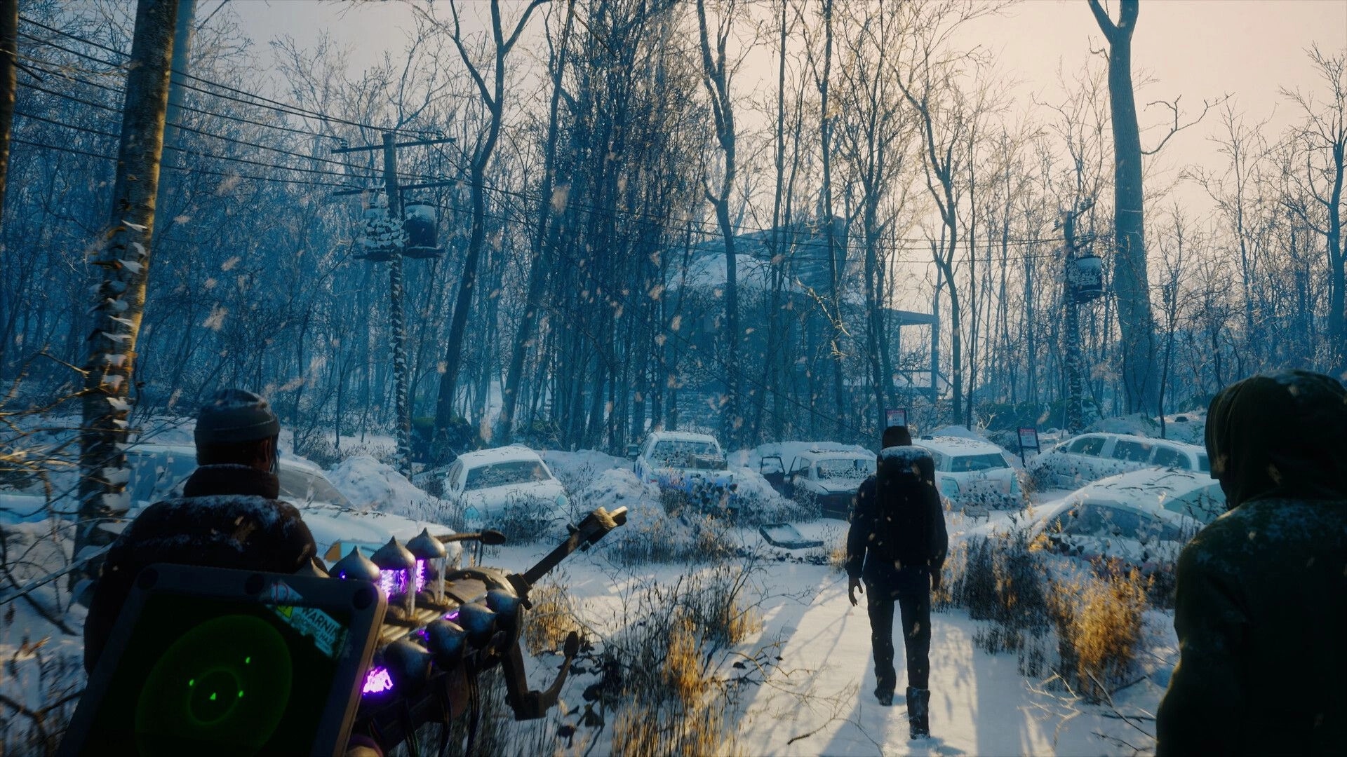 Macabre: Players trek through a snow-covered forest with abandoned cars and a device showing radar signals.